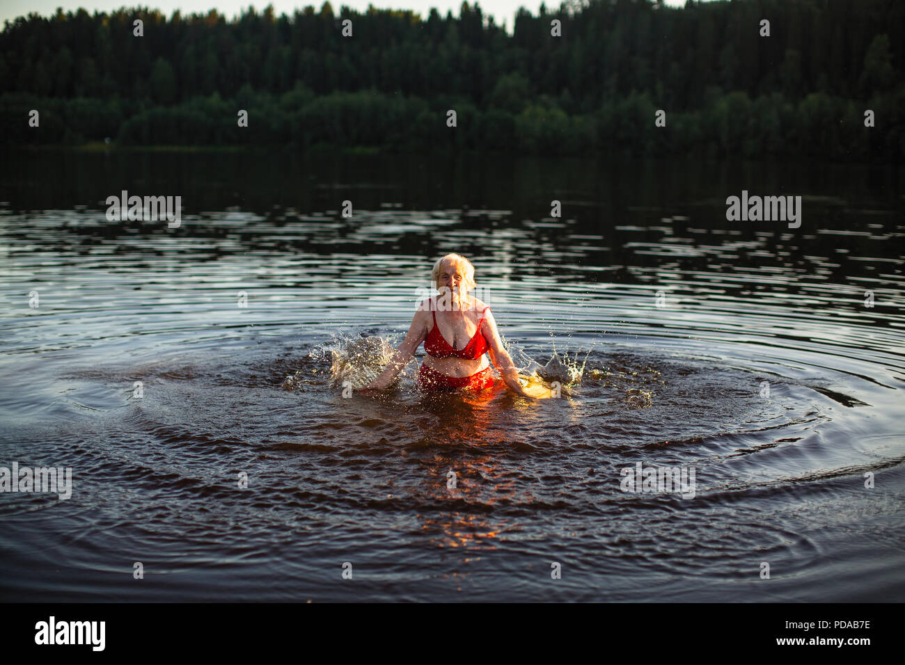 Elderly woman swimming hi-res stock photography and images - Alamy