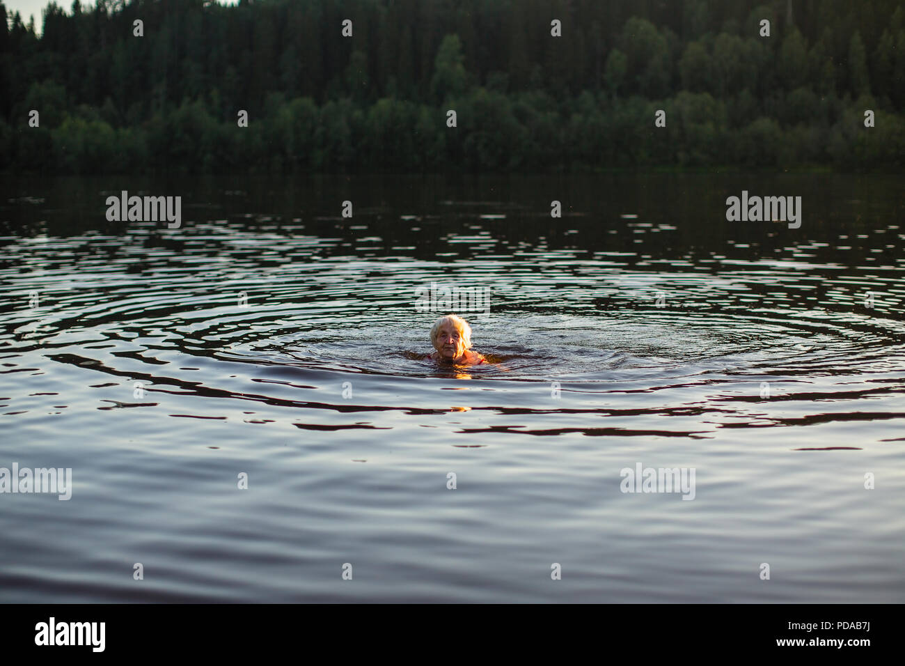 Elderly woman swimming hi-res stock photography and images - Alamy