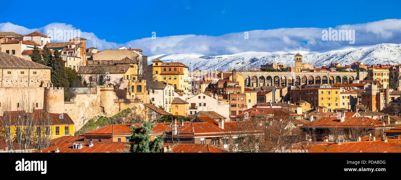 Beautiful Segovia town,view with old bridge,cathedral and mountains,Spain. Stock Photo
