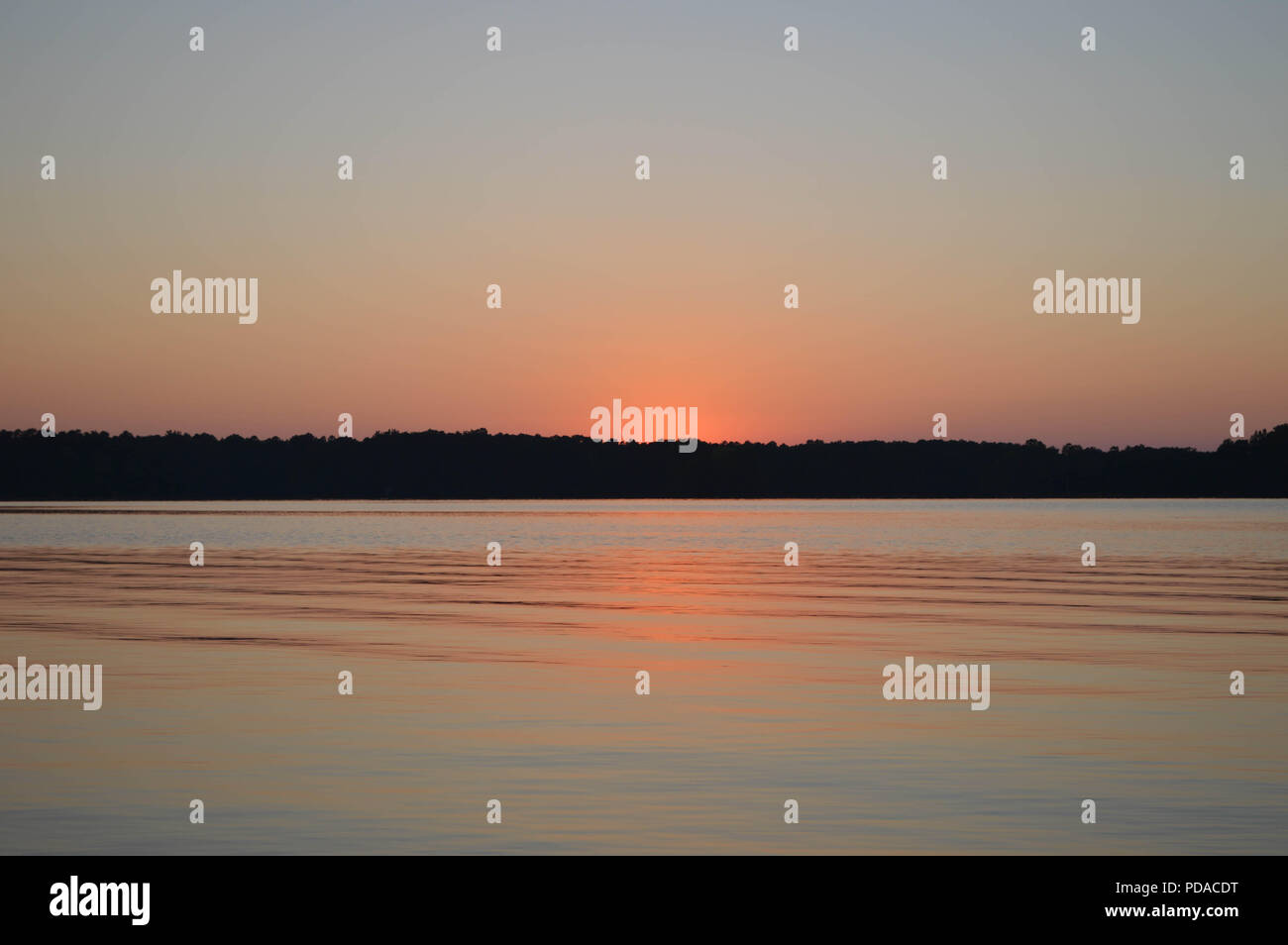 Serene Sunset Reflection On A Beautiful Lake in North Carolina Stock Photo