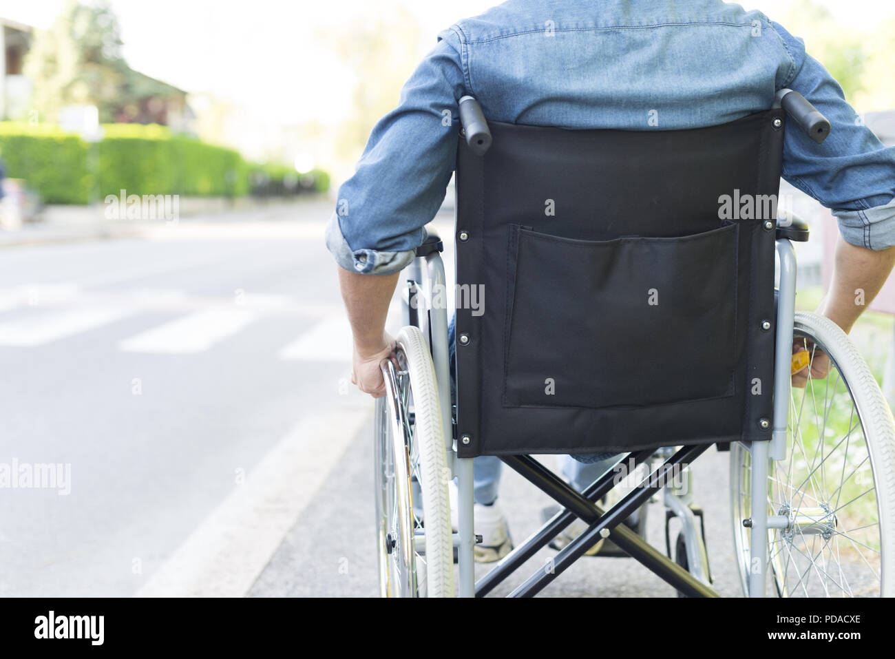 Sick man in a wheelchair hi-res stock photography and images - Alamy