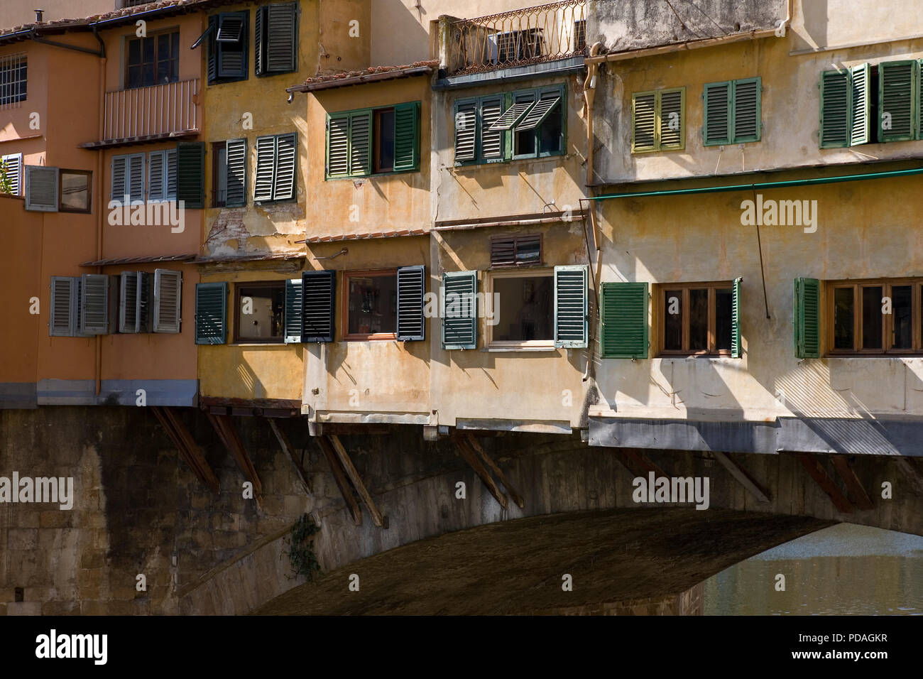 Close-up of the famous Ponte Vecchio spanning the River Arno in Florence Tuscany, Italy: apartments built on the bridge. Stock Photo