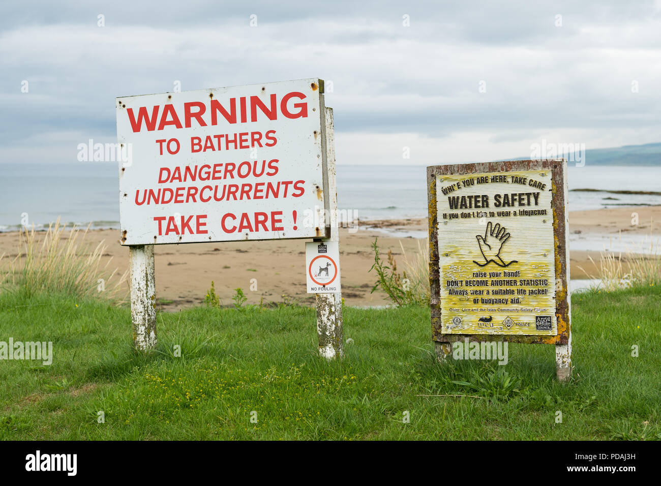 Warning to bathers dangerous undercurrents sign signs at Machrihanish Bay, Argyll and Bute, Scotland, UK Stock Photo