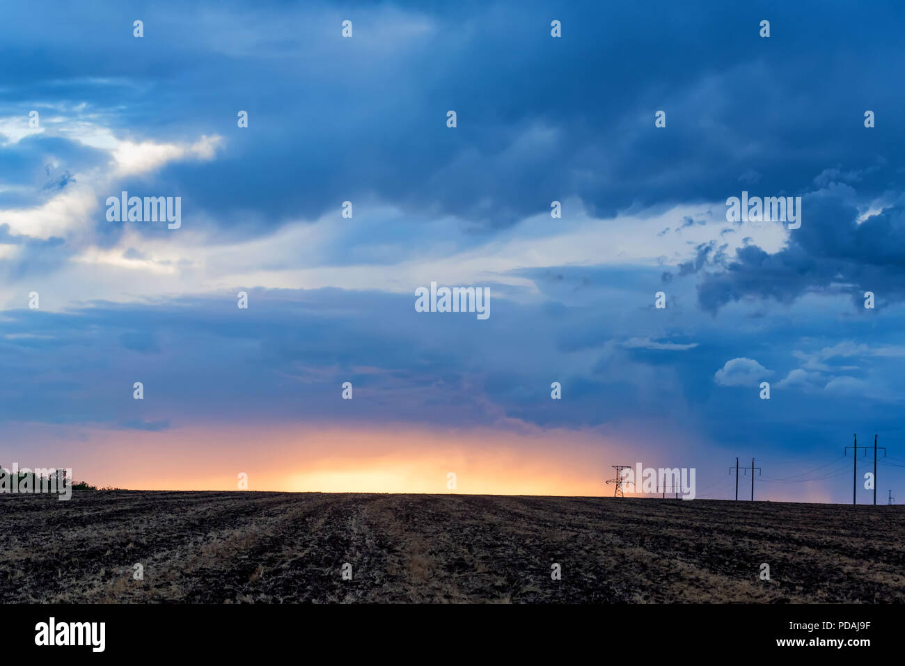 Rural landscape with power poles at sunrise Stock Photo - Alamy