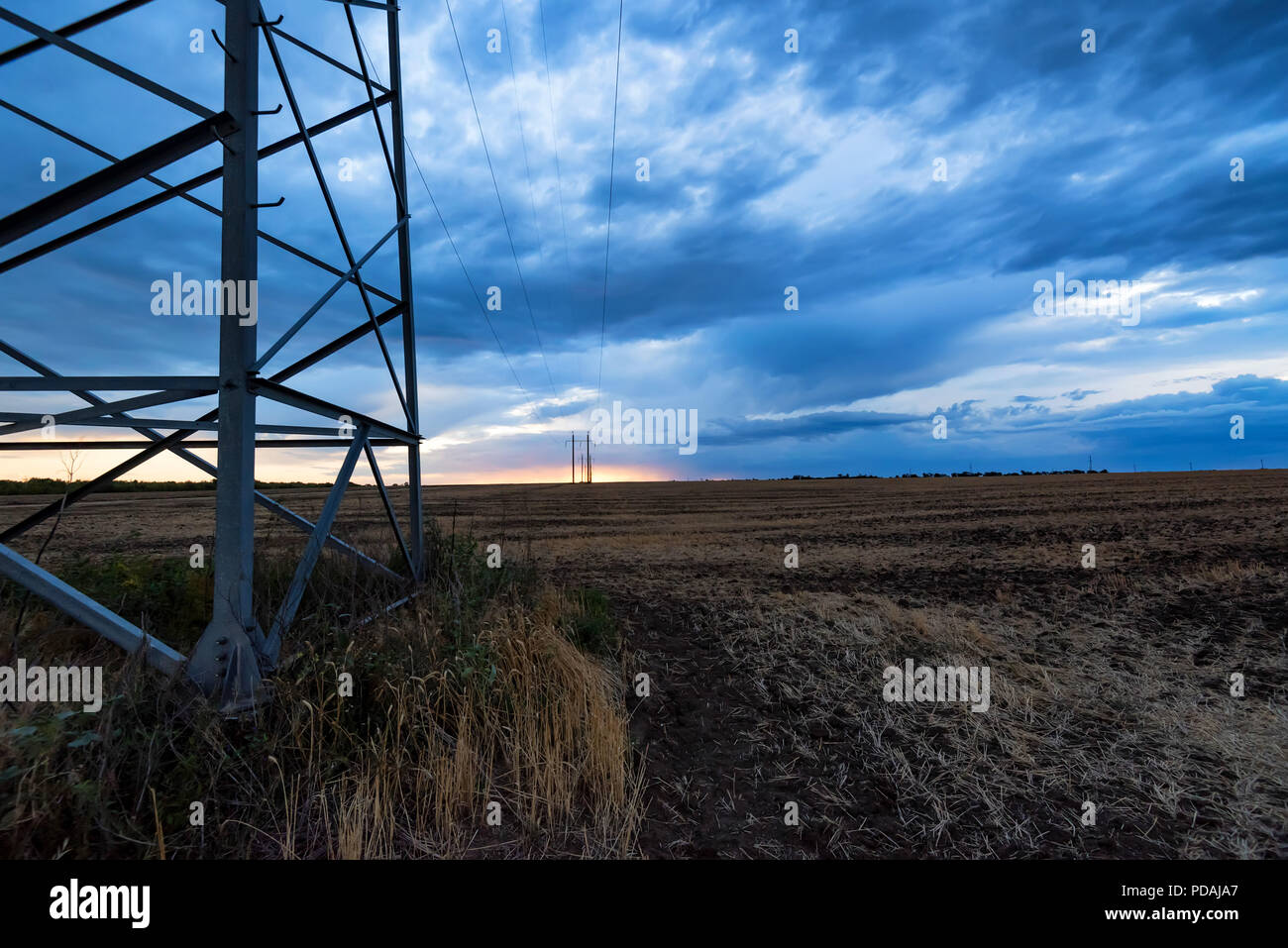 Rural landscape with electricity pole at sunrise Stock Photo - Alamy