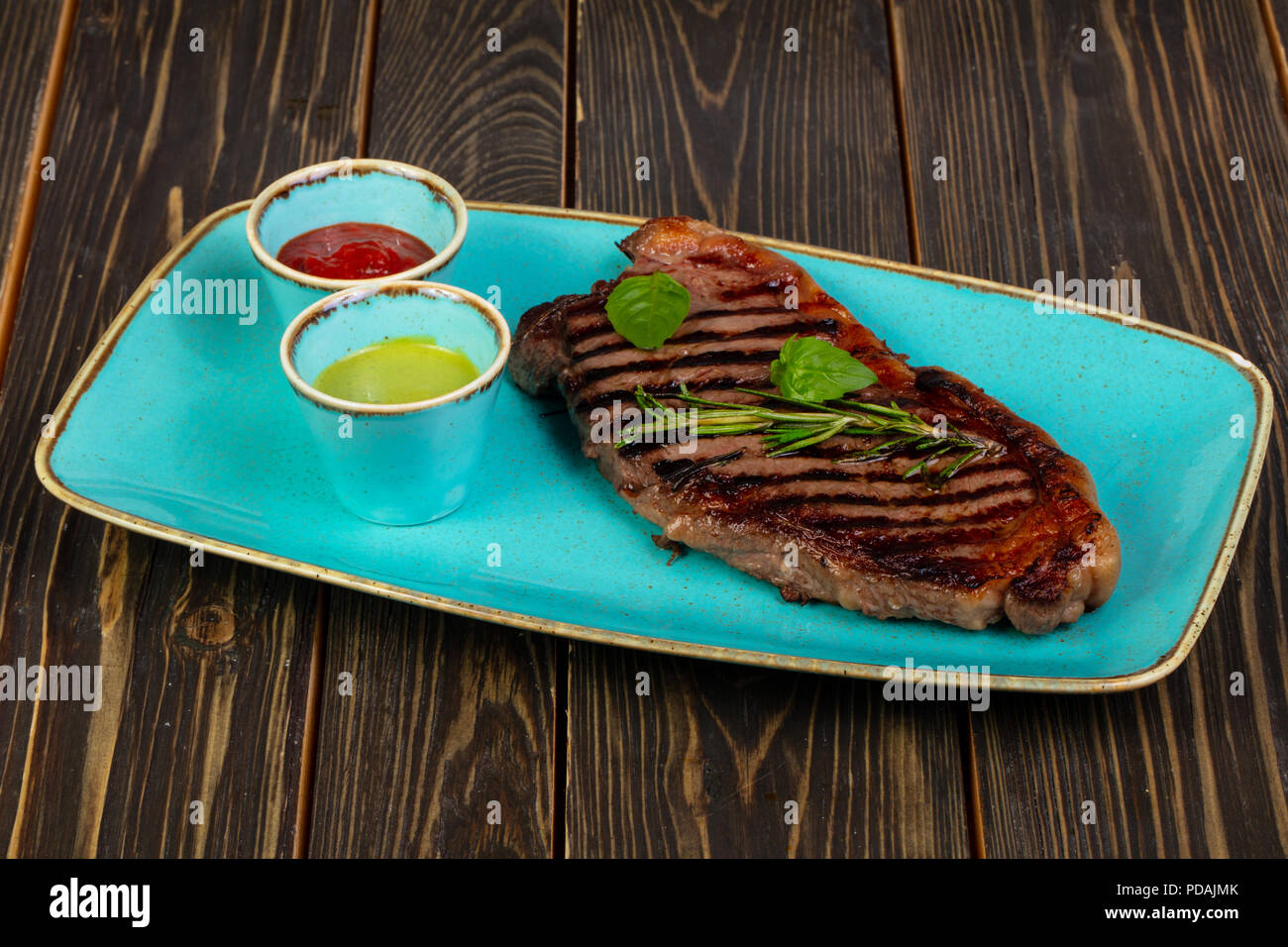 Grilled steak striploin with rosemary Stock Photo Alamy