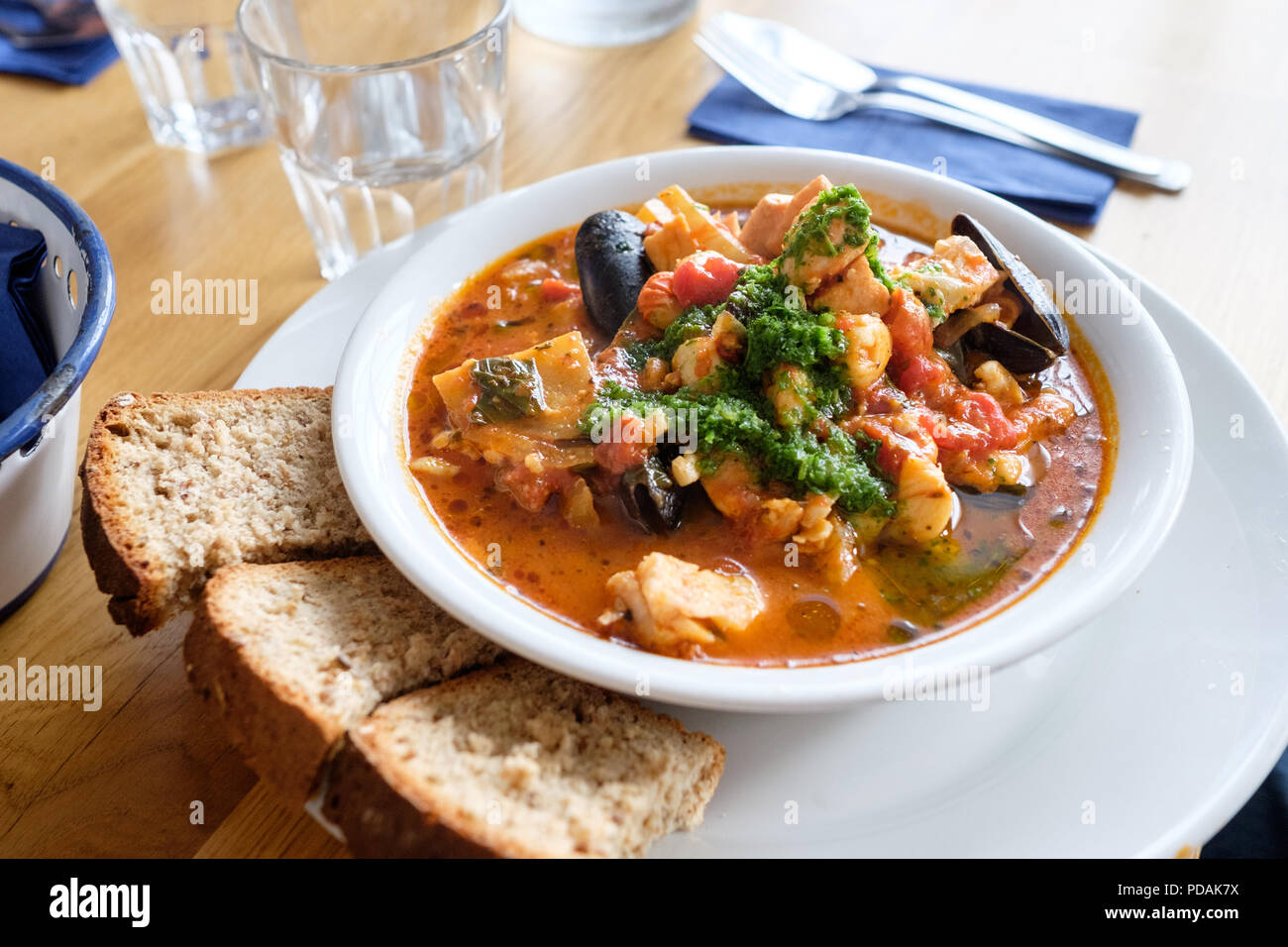 Café Fish Stew at Café Fish in Tobermory, Isle of Mull, Scotland, containing haddock, salmon, smoked haddock, queenies and mussels in a rich tomato sa Stock Photo