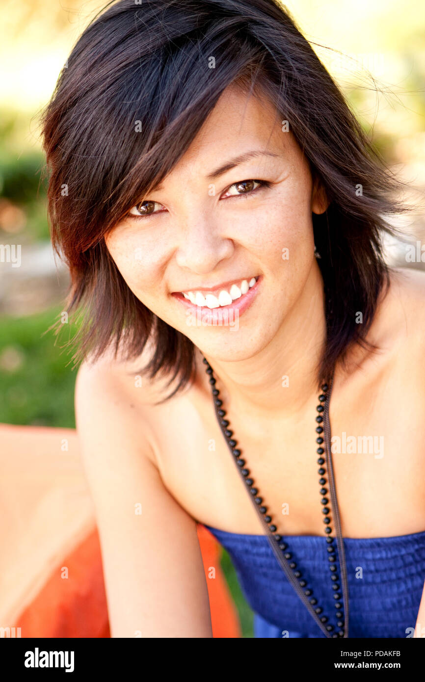Portrait of a happy Asian woman smiling. Stock Photo