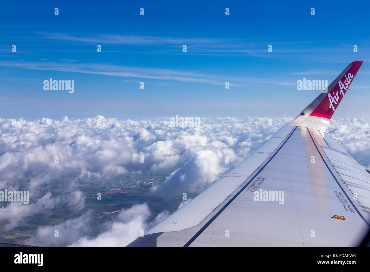 Editorial: June 26, 2018, Air Asia, Bali Indonesia. Aircraft wind and  AirAsia writing on the wind with blue sky and clouds Stock Photo - Alamy