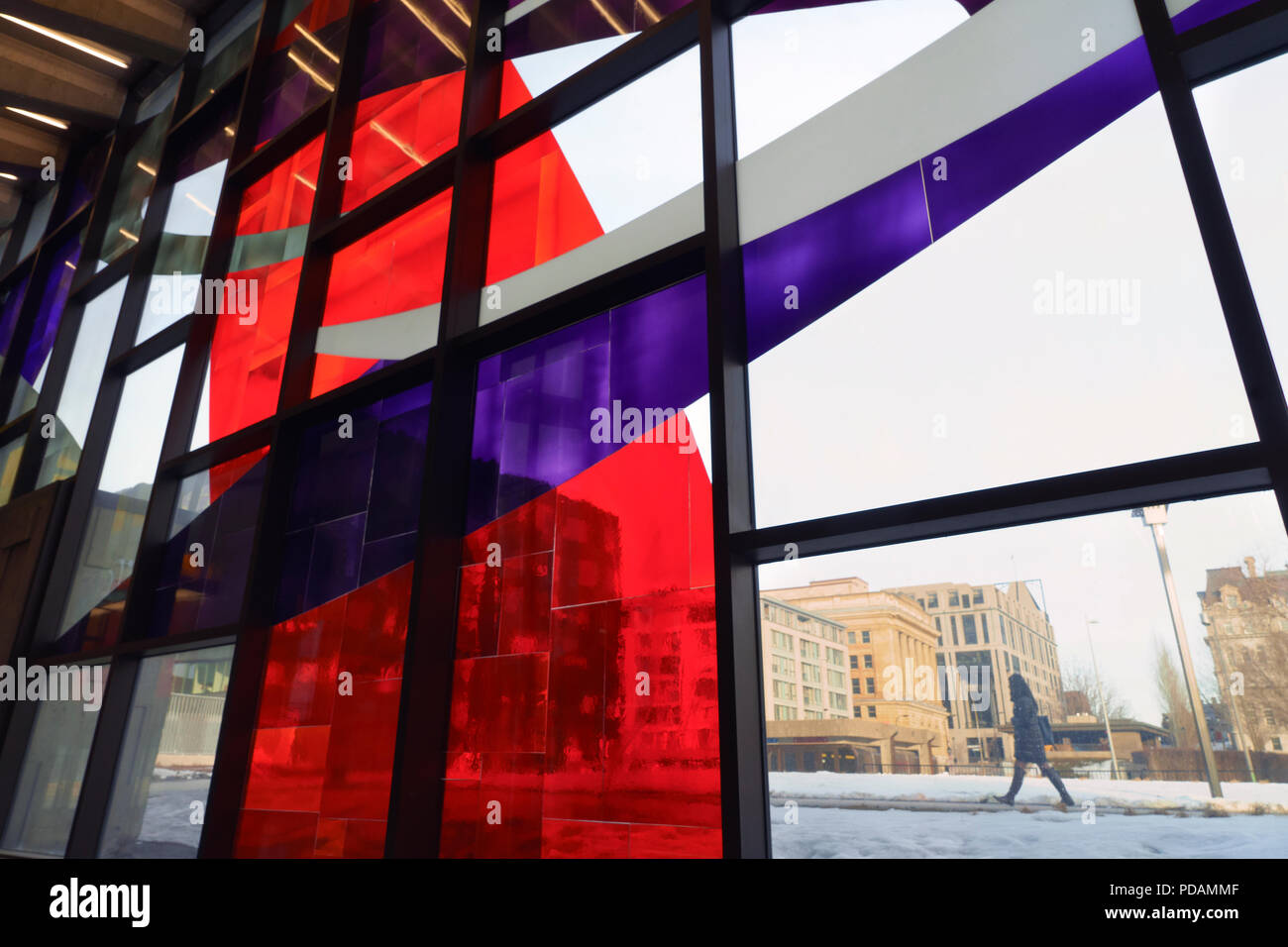 Pedestrian seen through the stained glass window of the Champ de Mars subway station, Montreal, province of Quebec, Canada. Stock Photo