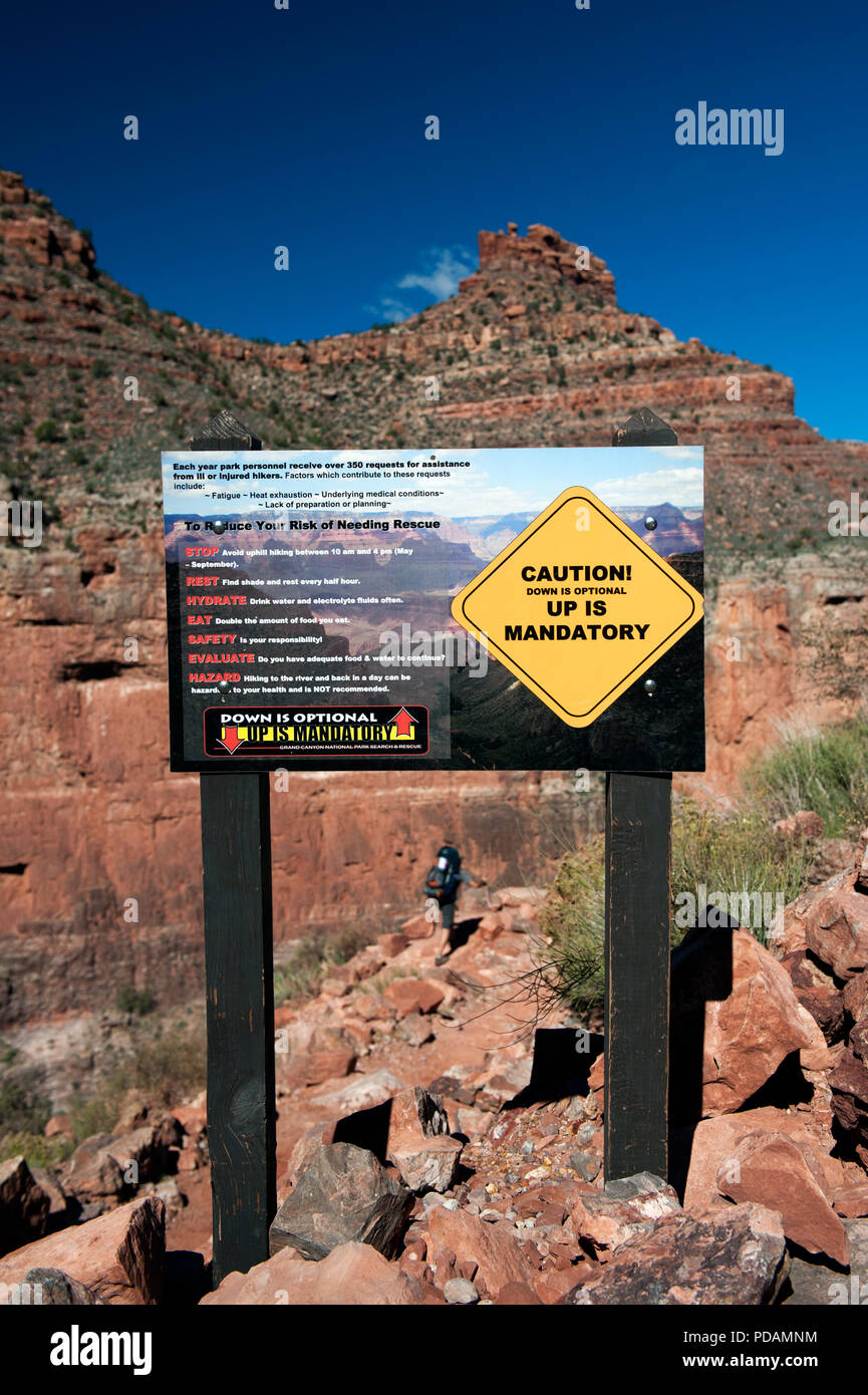 Sign warning hikers against the dangers of exhaustion, heat and injuries, Bright Angel trail, Grand Canyon National Park, USA. Stock Photo