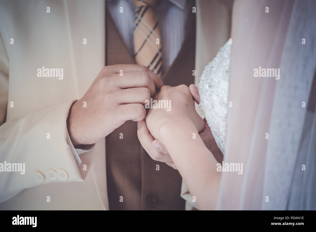 Wedding couple holding hands a symbol of love and marriage. Stock Photo