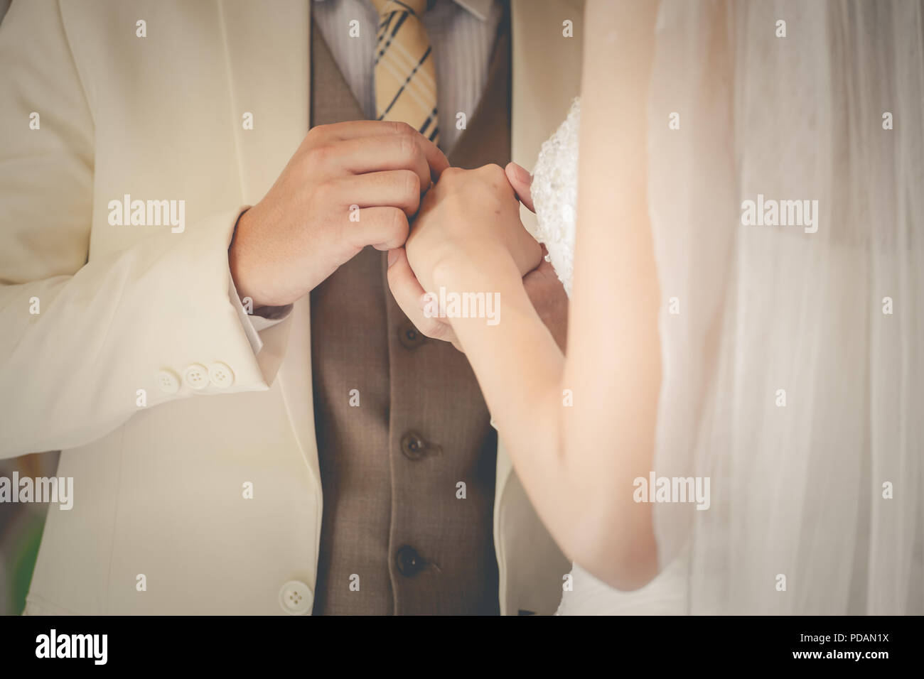 Wedding couple holding hands a symbol of love and marriage. Stock Photo