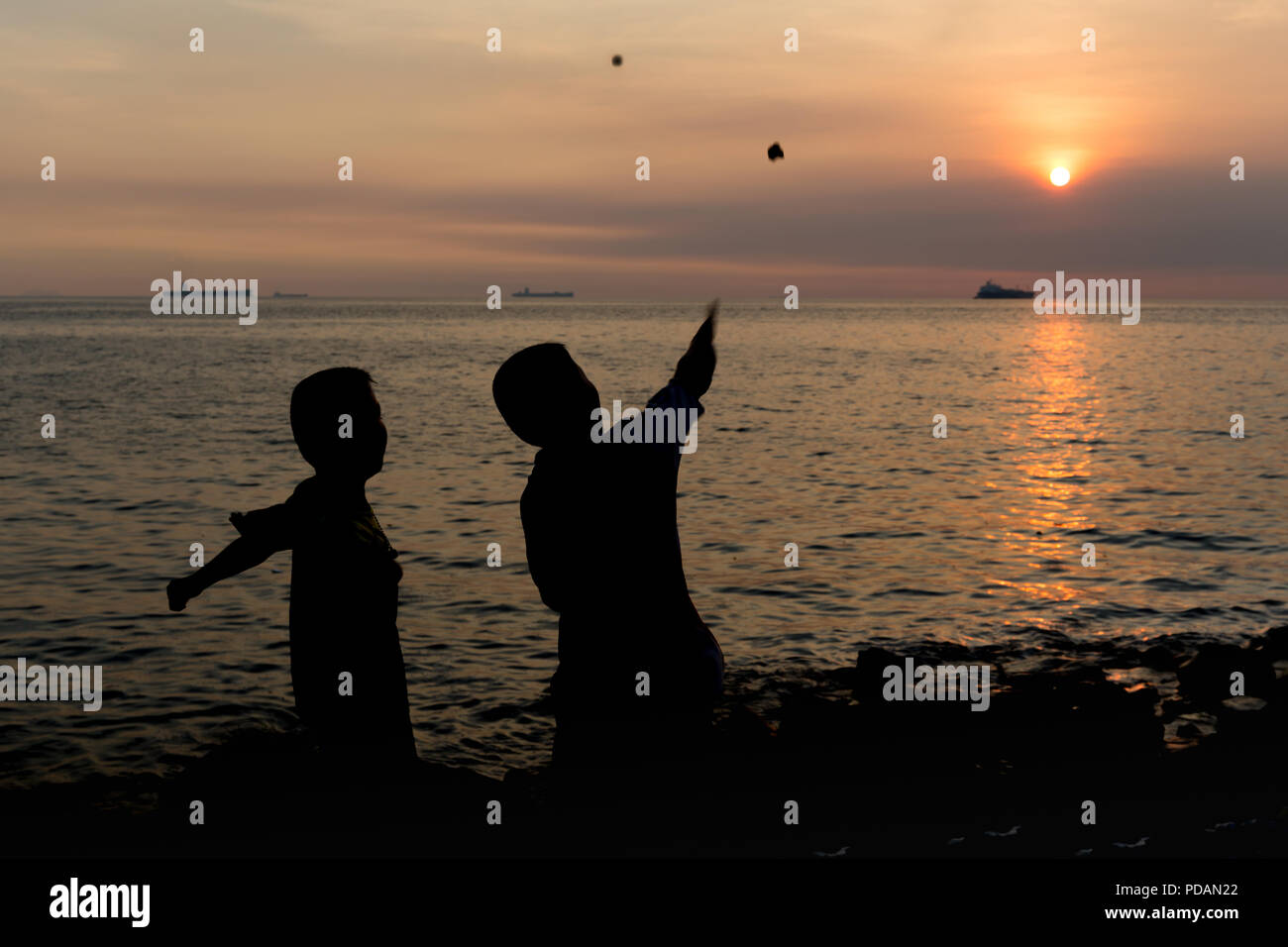 Throwing a rock game hires stock photography and images Alamy