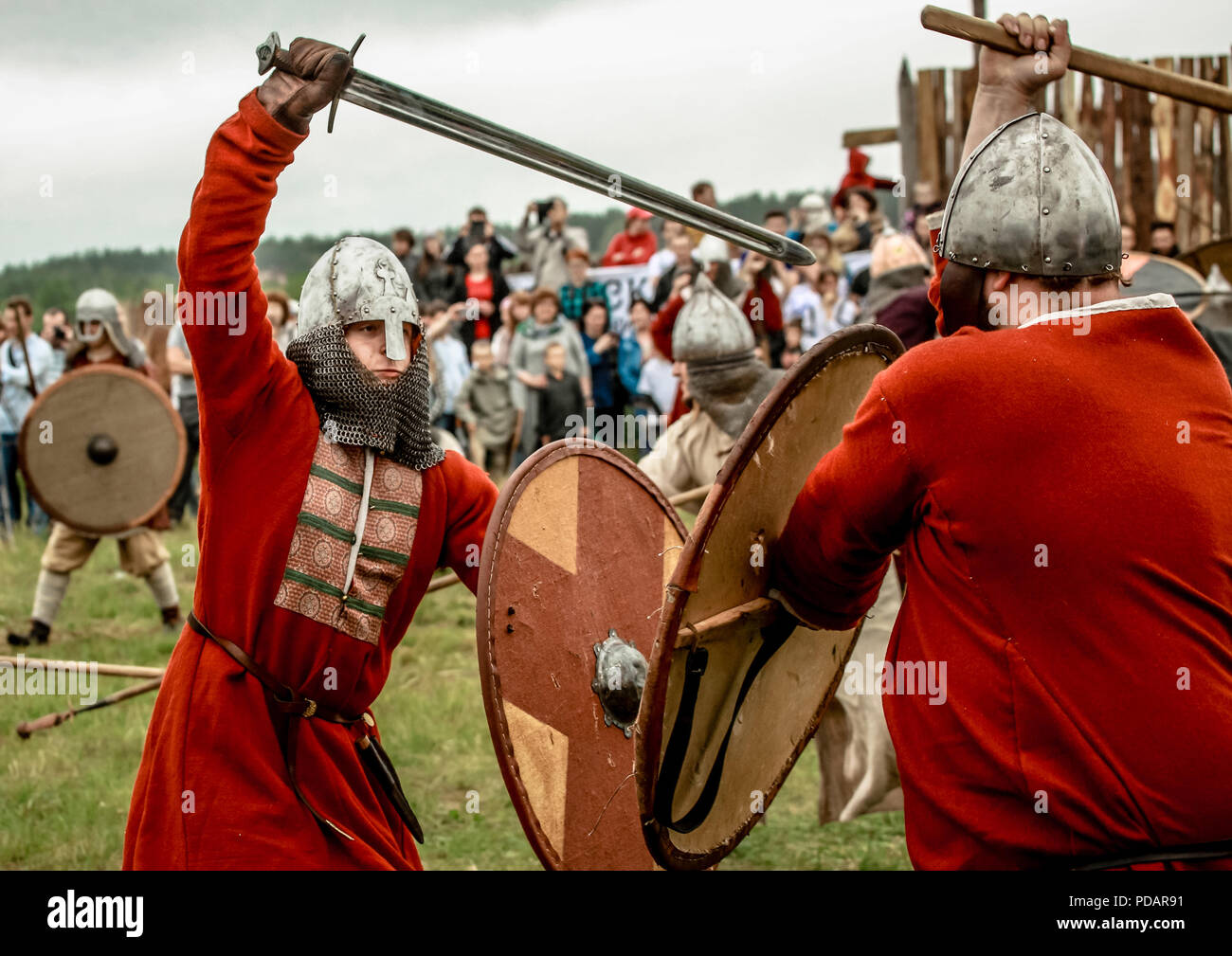 07.22.2017 Russia, Bryansk. Festival for lovers of historical military reconstruction. People dressed in clothes of Vikings and Russian heroes armed with cold weapons are divided into two groups fighting each other. Stock Photo