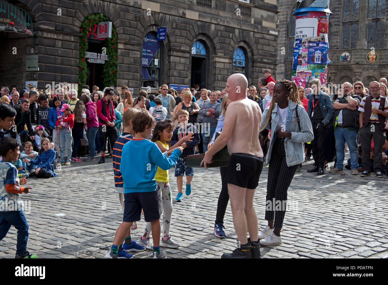 Edinburgh Fringe Festival street performer accepting tips after show Stock Photo