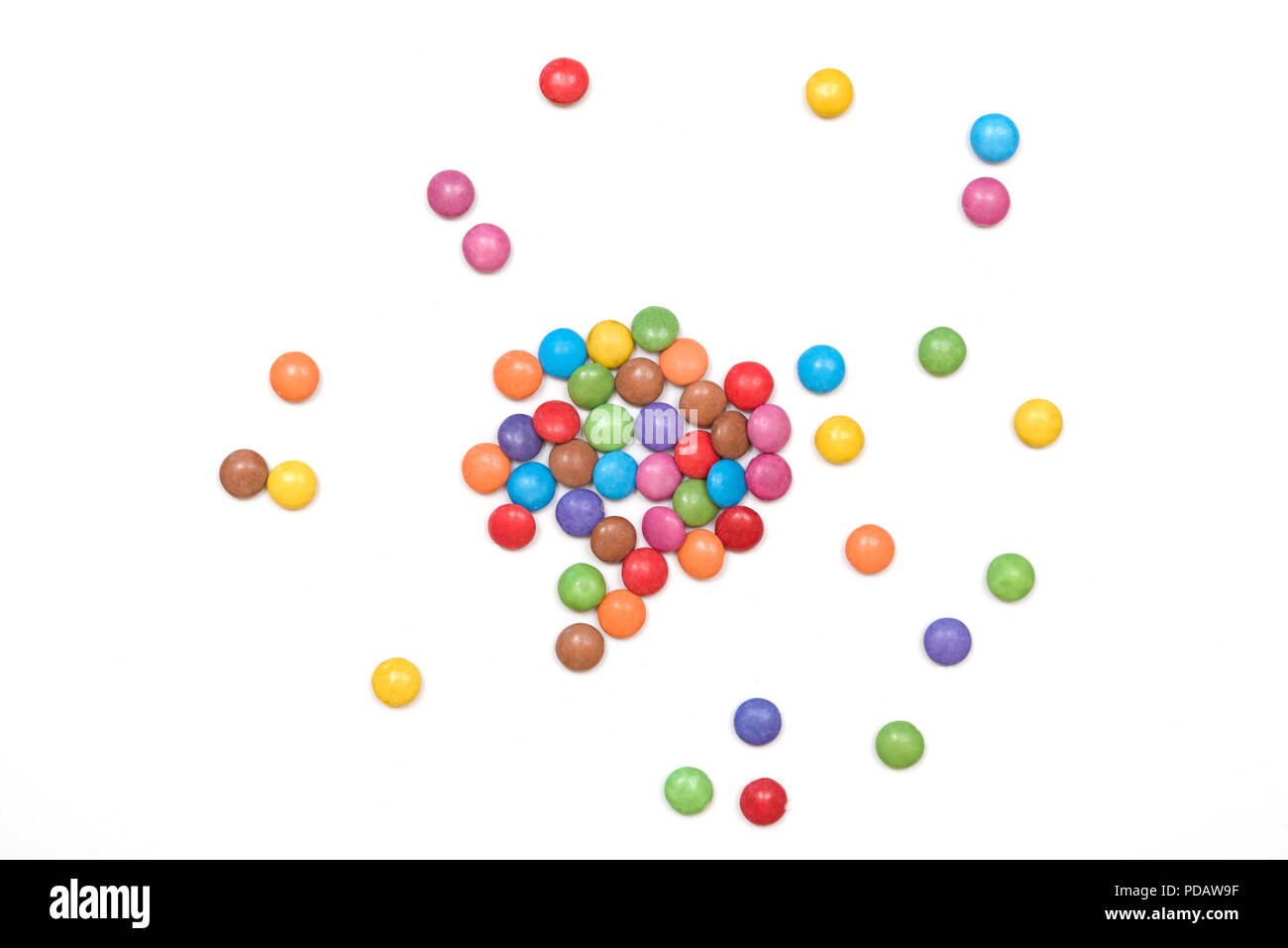 Multi colored sugar coated candies isolated on a white background Stock Photo