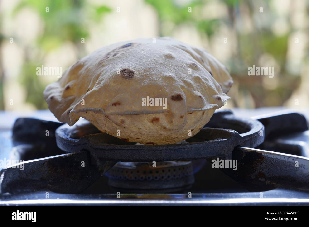 Phulka A Kind Of Chapati Home Made Indian Thin Bread Being Cooked On 