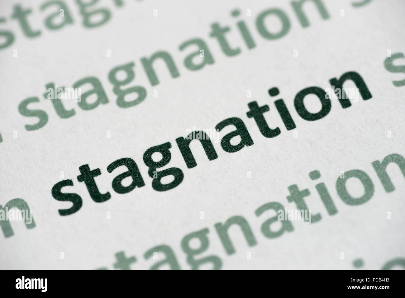 word stagnation printed on white paper macro Stock Photo Alamy
