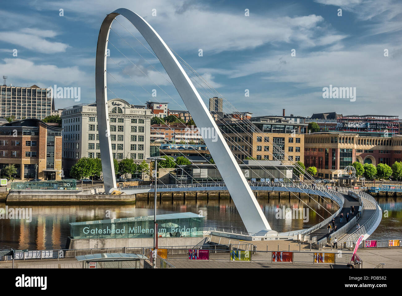 Looking across the Tyne River to the Gateshead Millennium Bridge and Newcastle Quayside Stock Photo