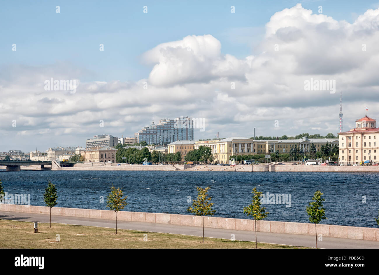SAINT-PETERSBURG, RUSSIA – AUGUST 4 2018: View of Neva River with Arsenal Quay and Lenin Square. Foreground is fragment of Resurrection Quay Stock Photo