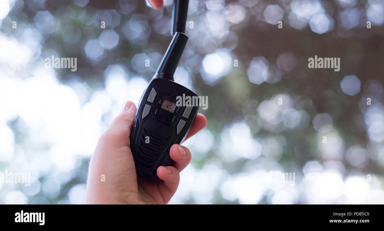 Black transmitters in hands before talking. Stock Photo