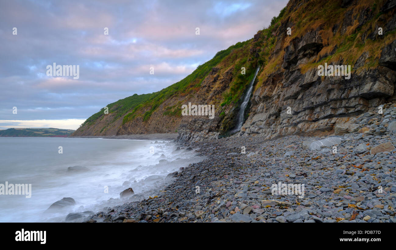 Summer sunset on the beach at Buck's Mill on the North Devon Coast, UK Stock Photo