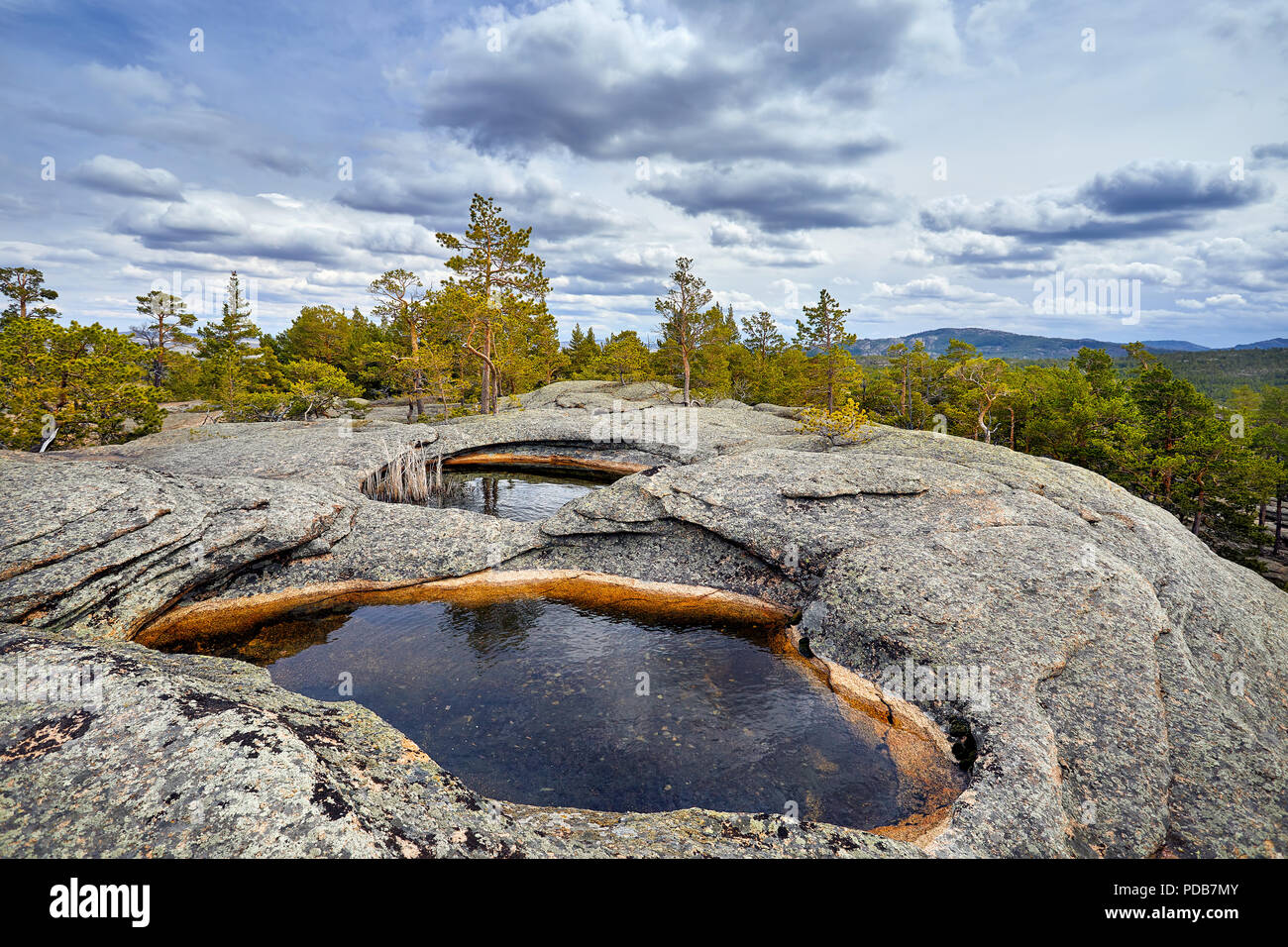 Beautiful Lake in the rocky mountains with pine wood of Karkaraly national park in Central Kazakhstan Stock Photo