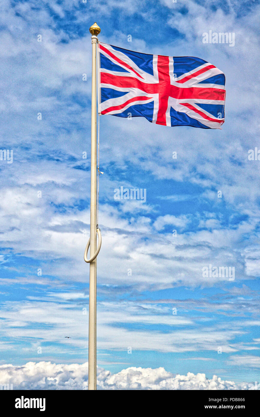 Union Jack Union Flag flying on flag pole Stock Photo