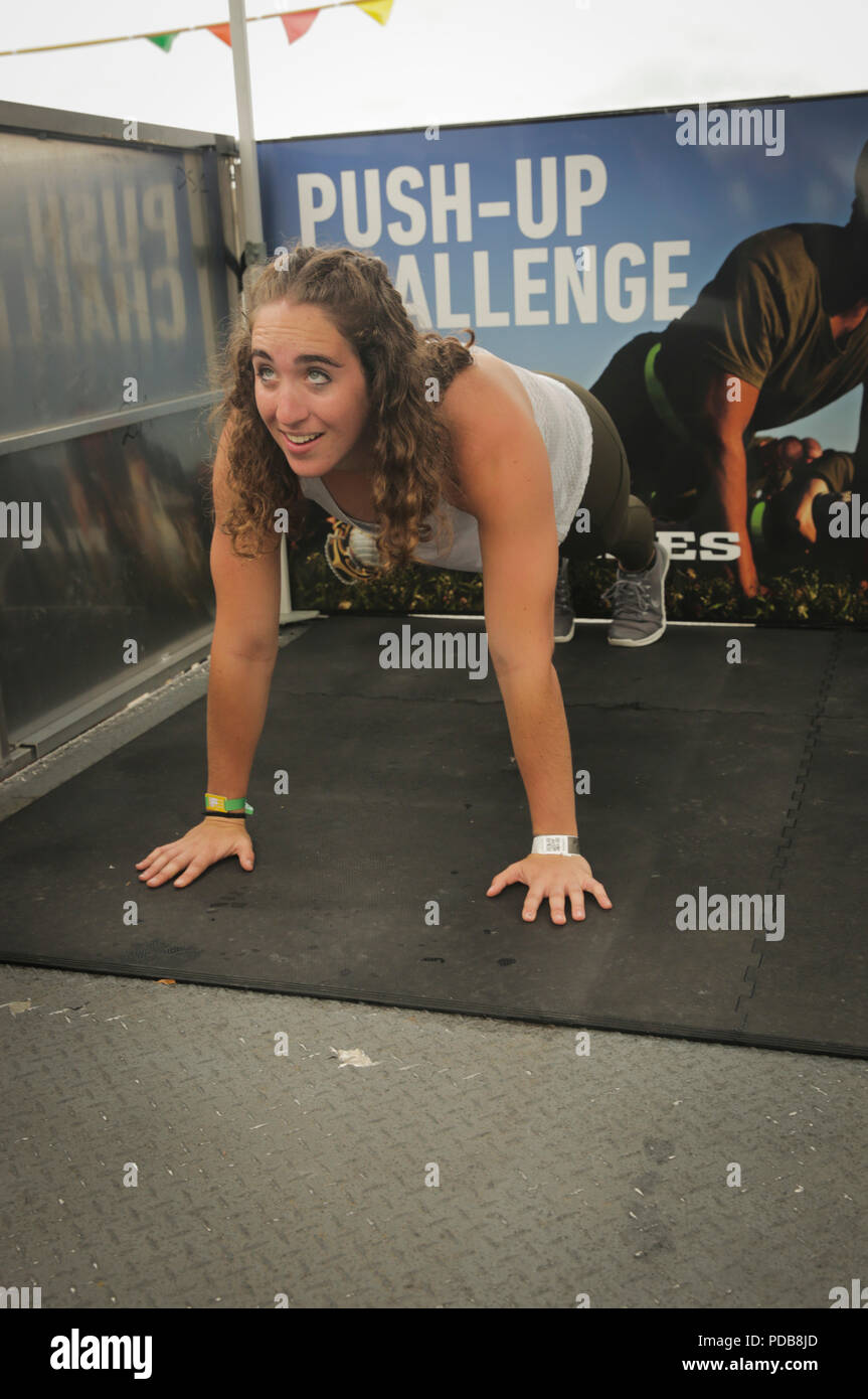 MADISON, Wisconsin – Morgan Laughlin, a native of Cincinnati, Ohio,  executes a push-up at the Marine Corps Battles Won Challenge trailer during  the 2018 Reebok CrossFit Games at the Alliant Energy Center,