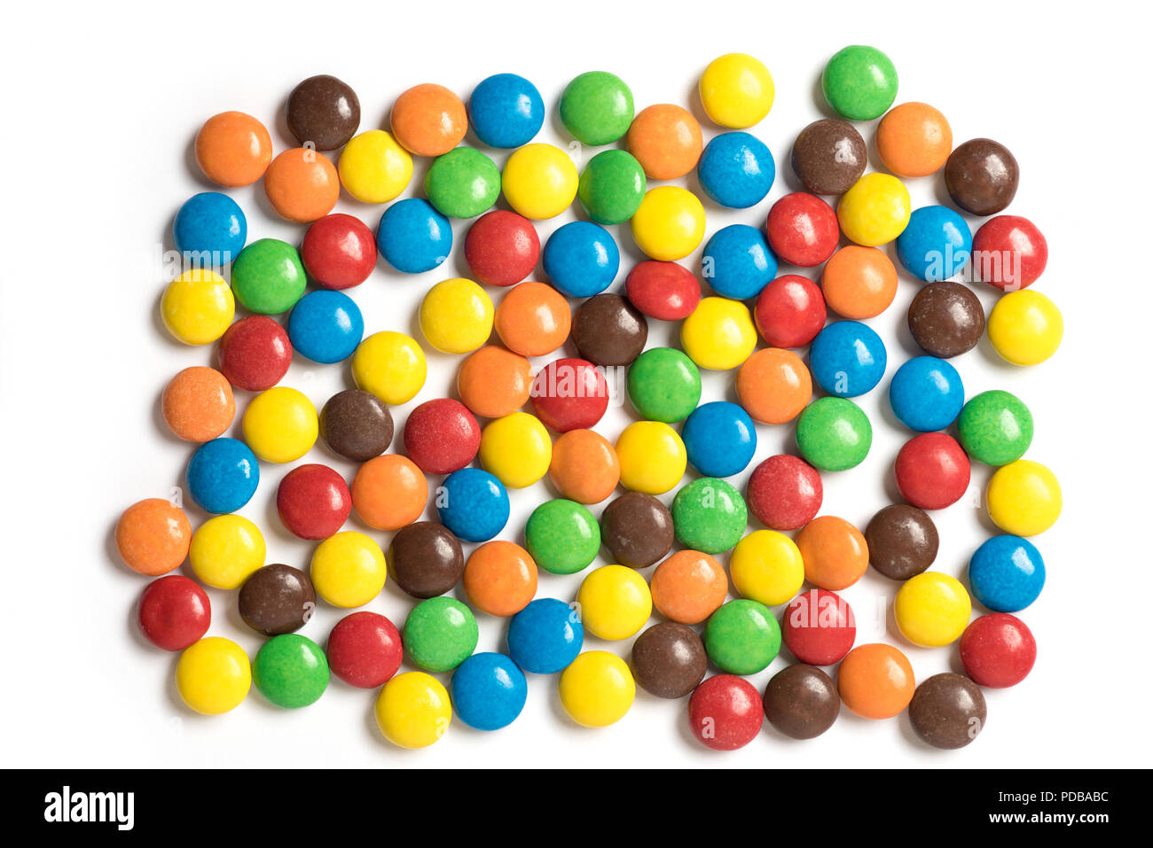 Colorful m&m candies randomly arranged on white background Stock Photo ...