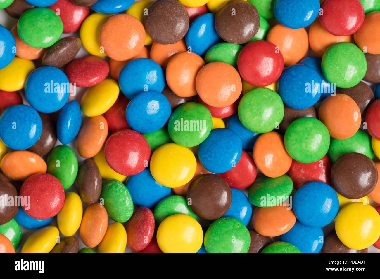 Multi colored m&m candies randomly arranged Stock Photo