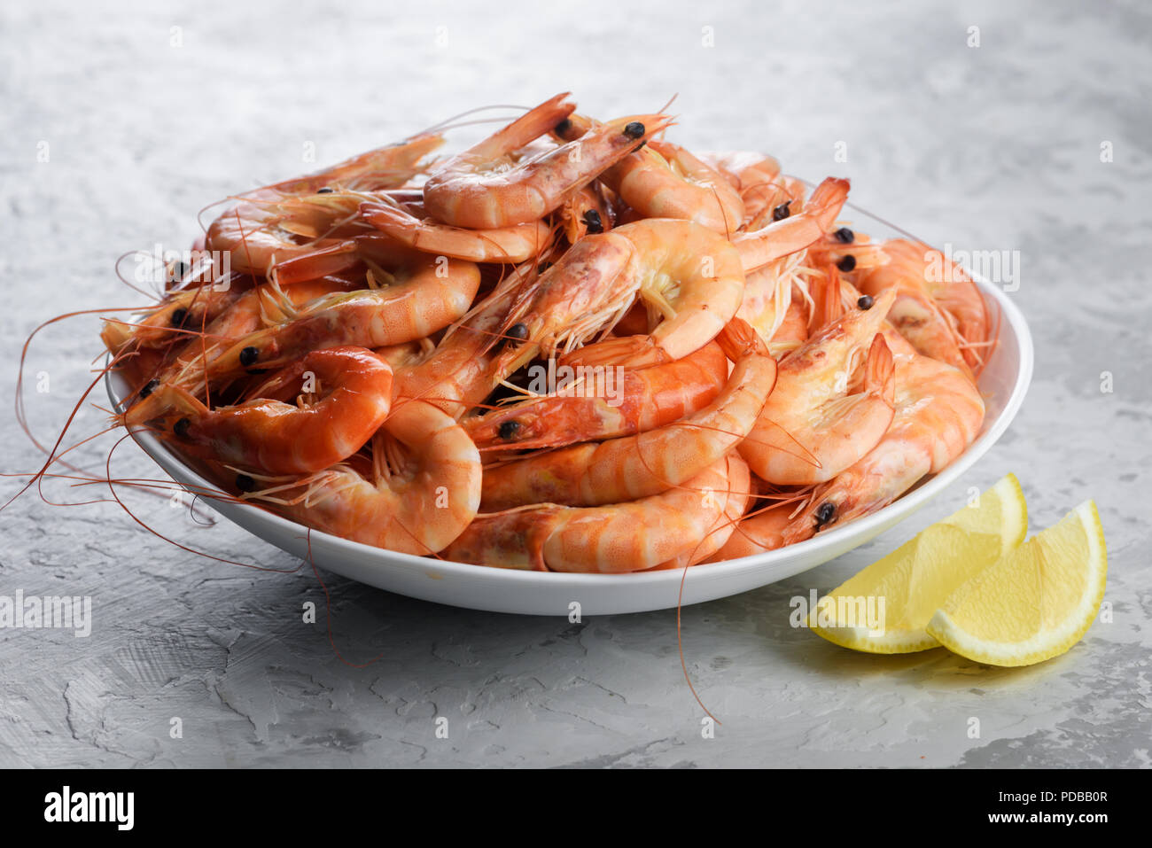 Big boiled shrimps in white plate Stock Photo