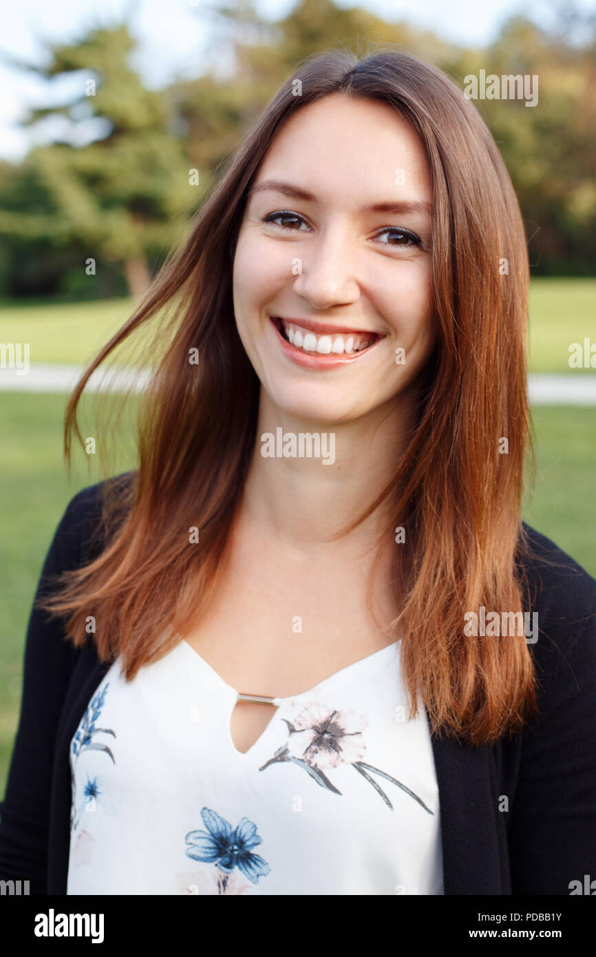 Closeup portrait of beautiful smiling young European Caucasian woman with red hair and brown eyes. Business lady outside looking in camera smiling Stock Photo - Alamy Closeup portrait of beautiful smiling young European Caucasian woman with red hair and brown eyes. Business lady outside looking in camera smiling Stock Photo - Alamy