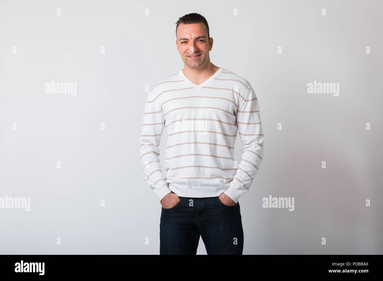 Portrait Of Happy Man Smiling Against White Background Stock Photo - Alamy