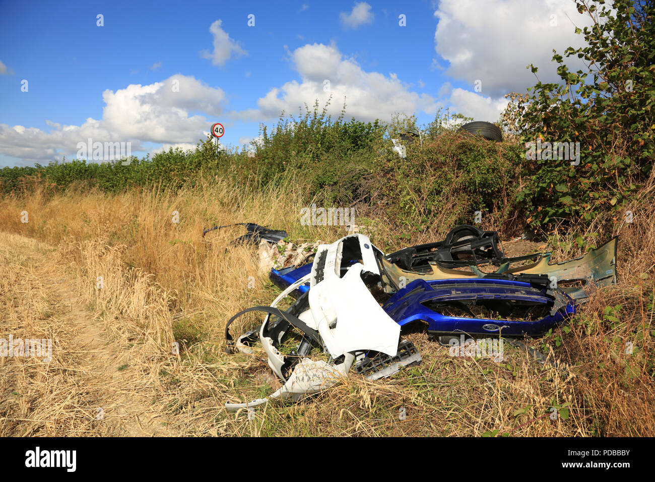 Dumped plastic car parts on farmland in the West midlands, UK. Stock Photo