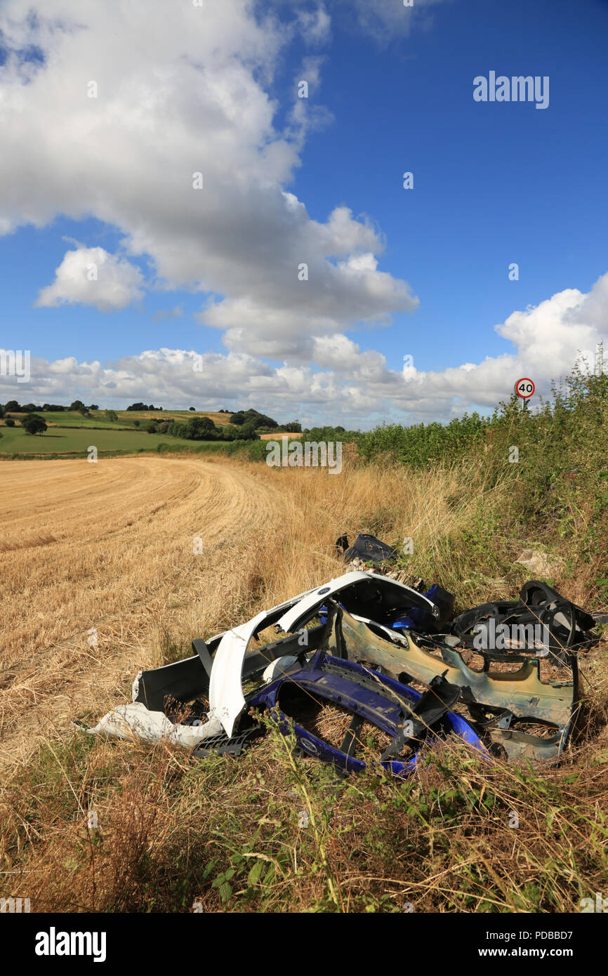 Dumped plastic car parts on farmland in the West midlands, UK. Stock Photo