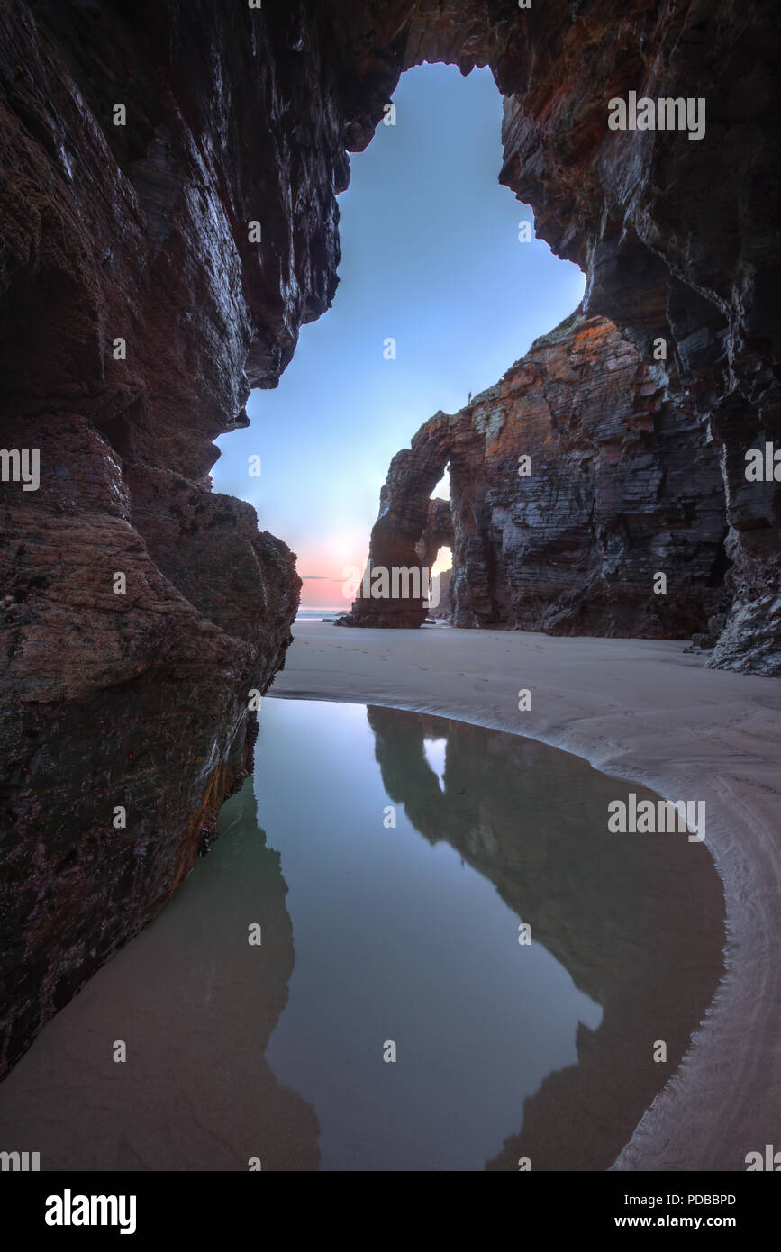 As Cathedrais, rock arches at sunrise, in Ribadeo, Lugo, Galicia Stock Photo