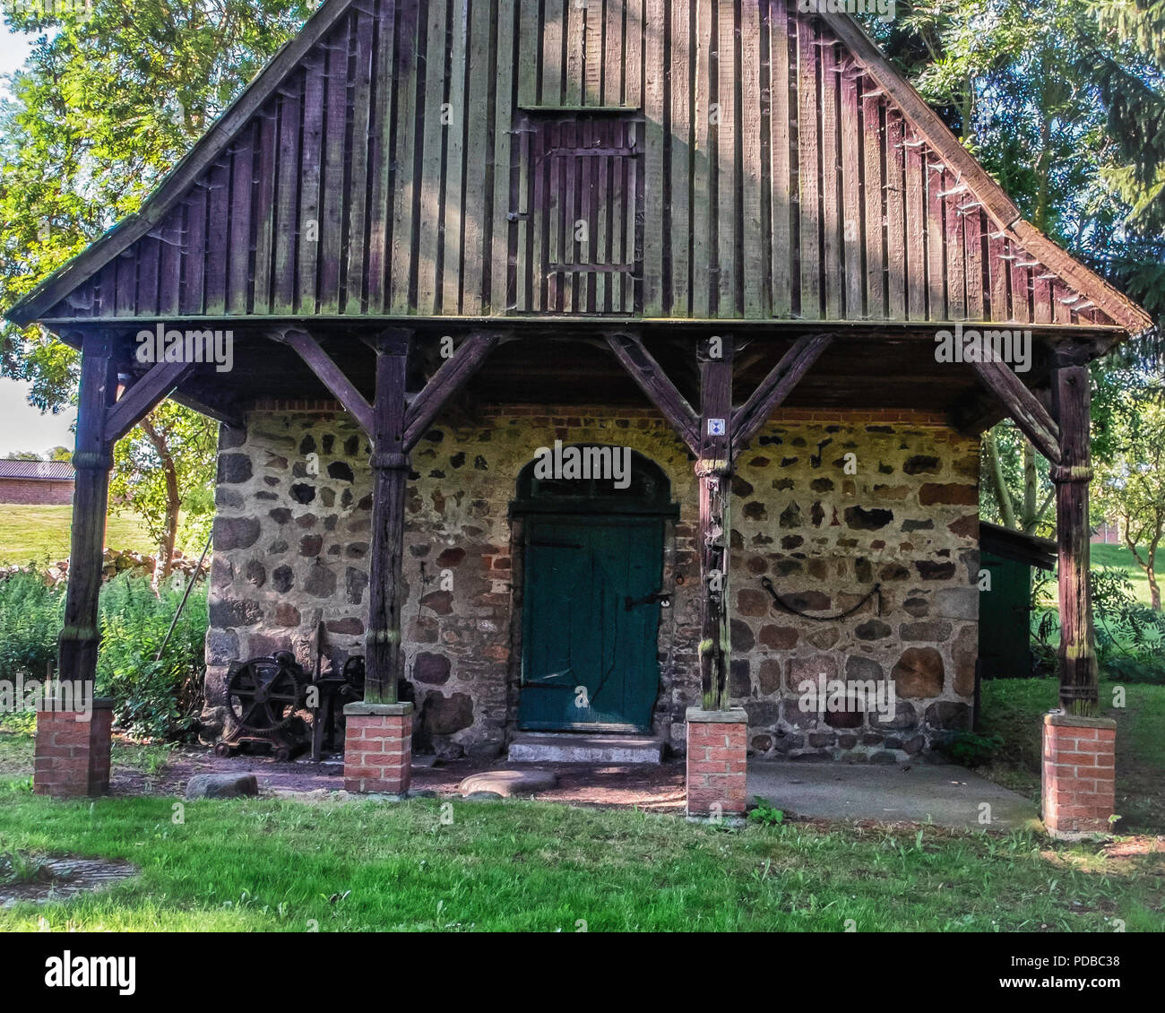 Germany,Stolpe an der Peene, Historic old blacksmith on Gutshaus Stolpe Estate grounds Listed stone building                    Gutshaus Stolpe histor Stock Photo