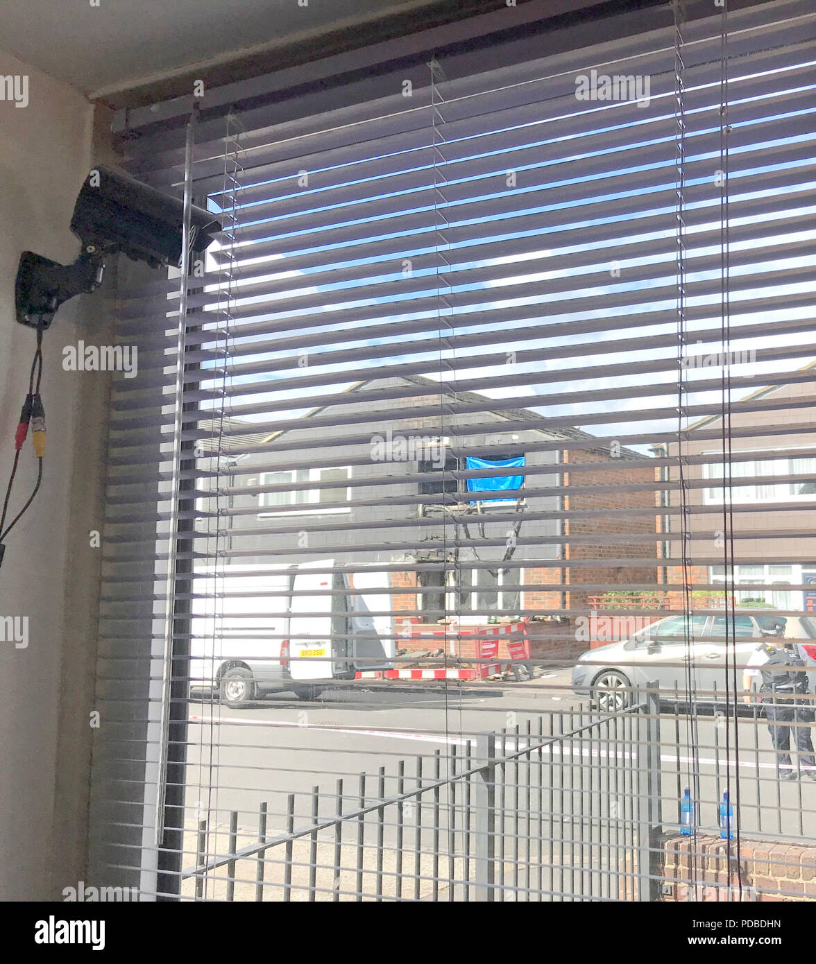 Cctv camera in the window of flat on adolphus street hires stock