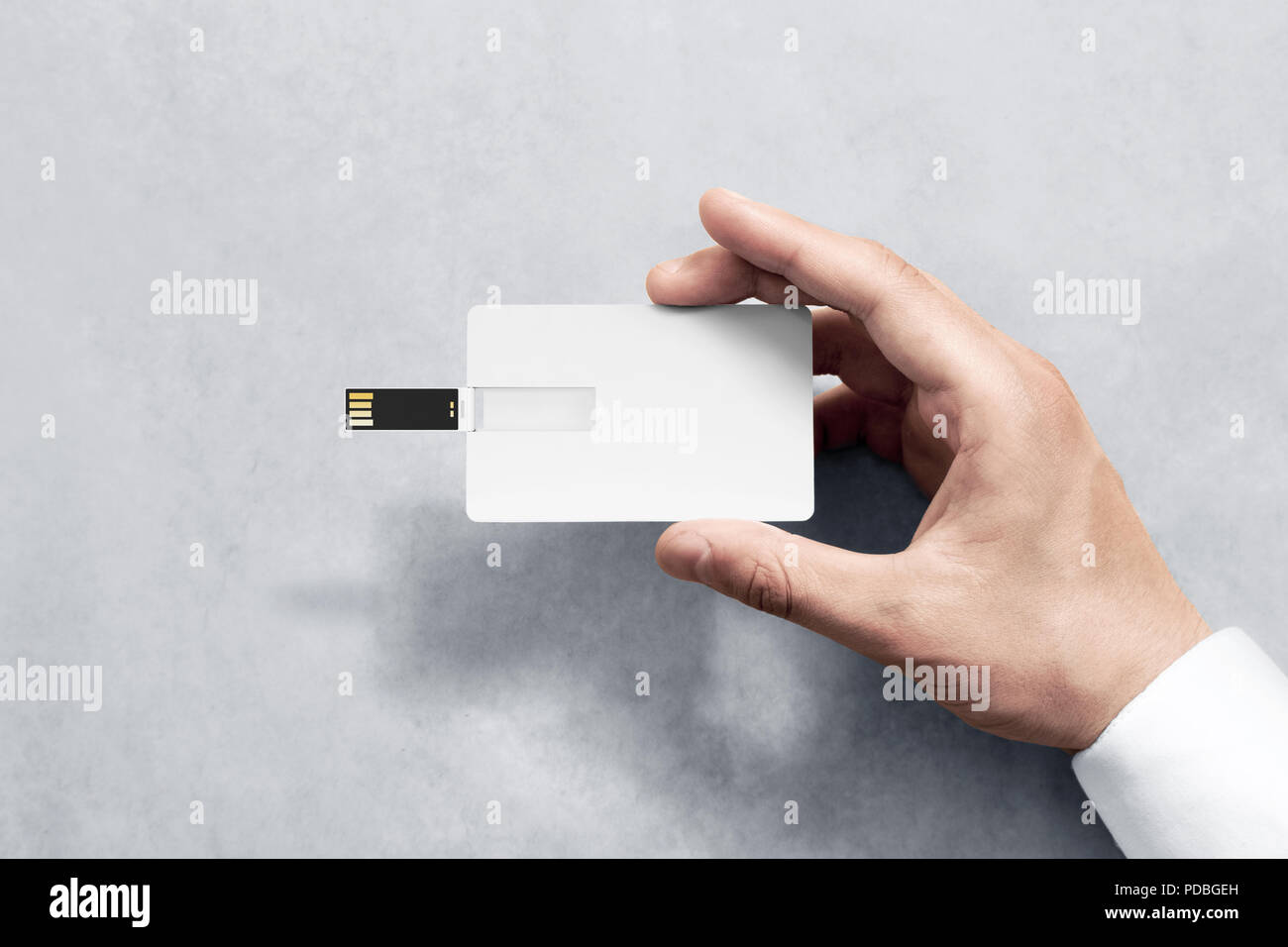 Download Blank White Plastic Wafer Usb Card Design Mockup Holding Hand Visiting Flash Drive Namecard Mock Up Call Card Disk Souvenir Presentation Flat Credit Stick Adapter Bussiness Favor In Mans Arm Stock Photo PSD Mockup Templates