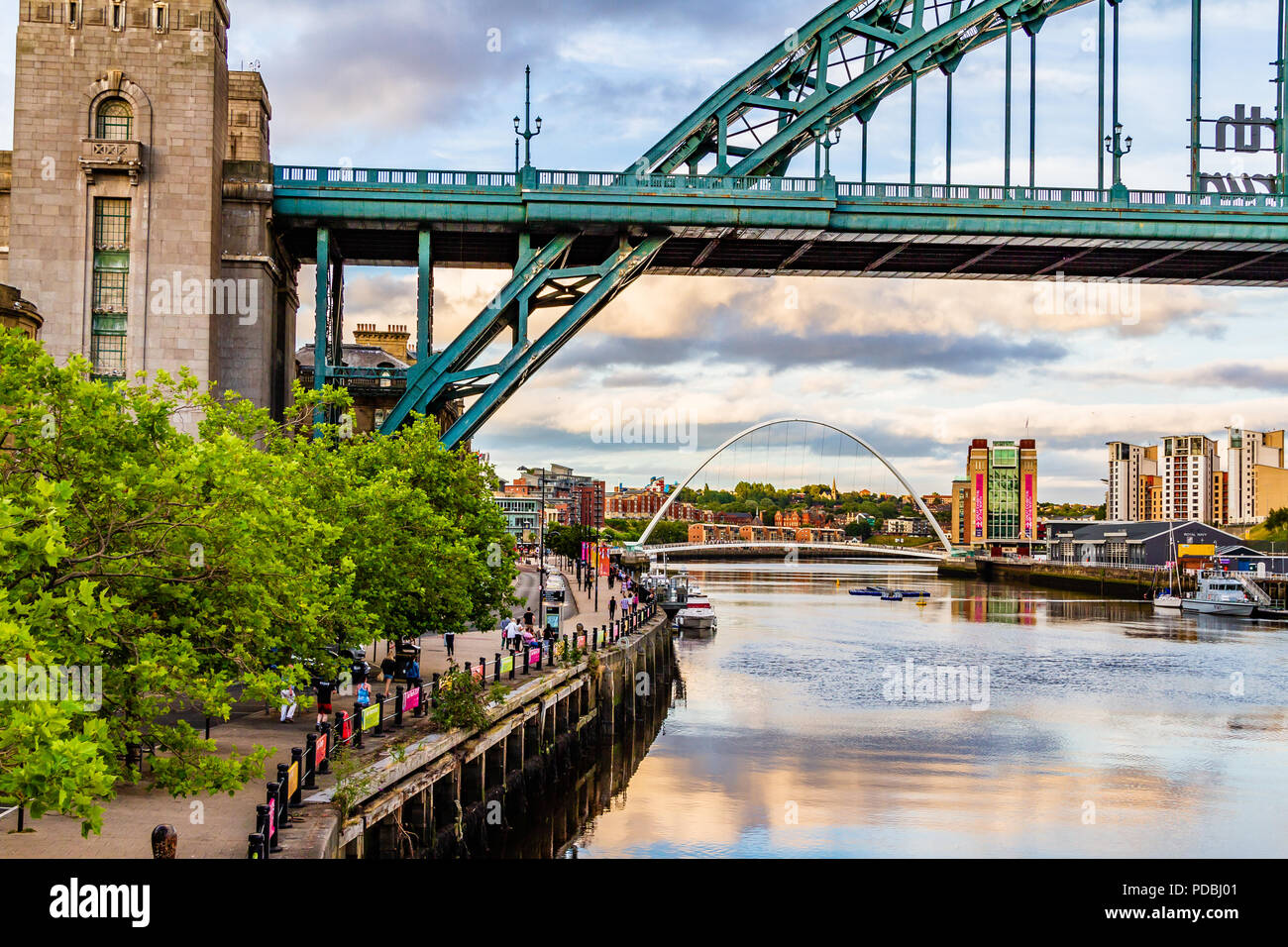 The Tyne riverside with the Tyne Bridge, Millennium Bridge and Baltic Art Gallery at sunset, Newcastle-upon-Tyne and Gateshead, UK. Stock Photo
