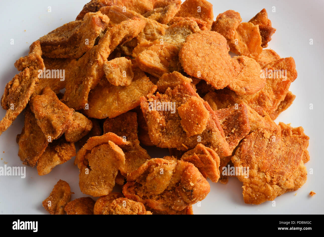 Pork rind favorite food in piedmonte italy, isolated on white in restaurant. Stock Photo