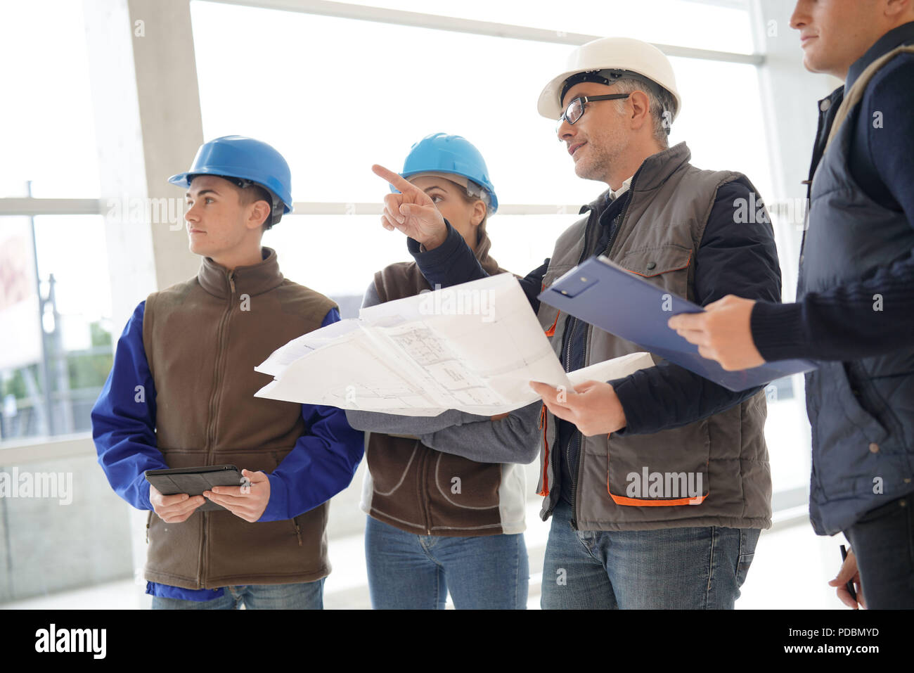 Instructor with young people in engineering training Stock Photo