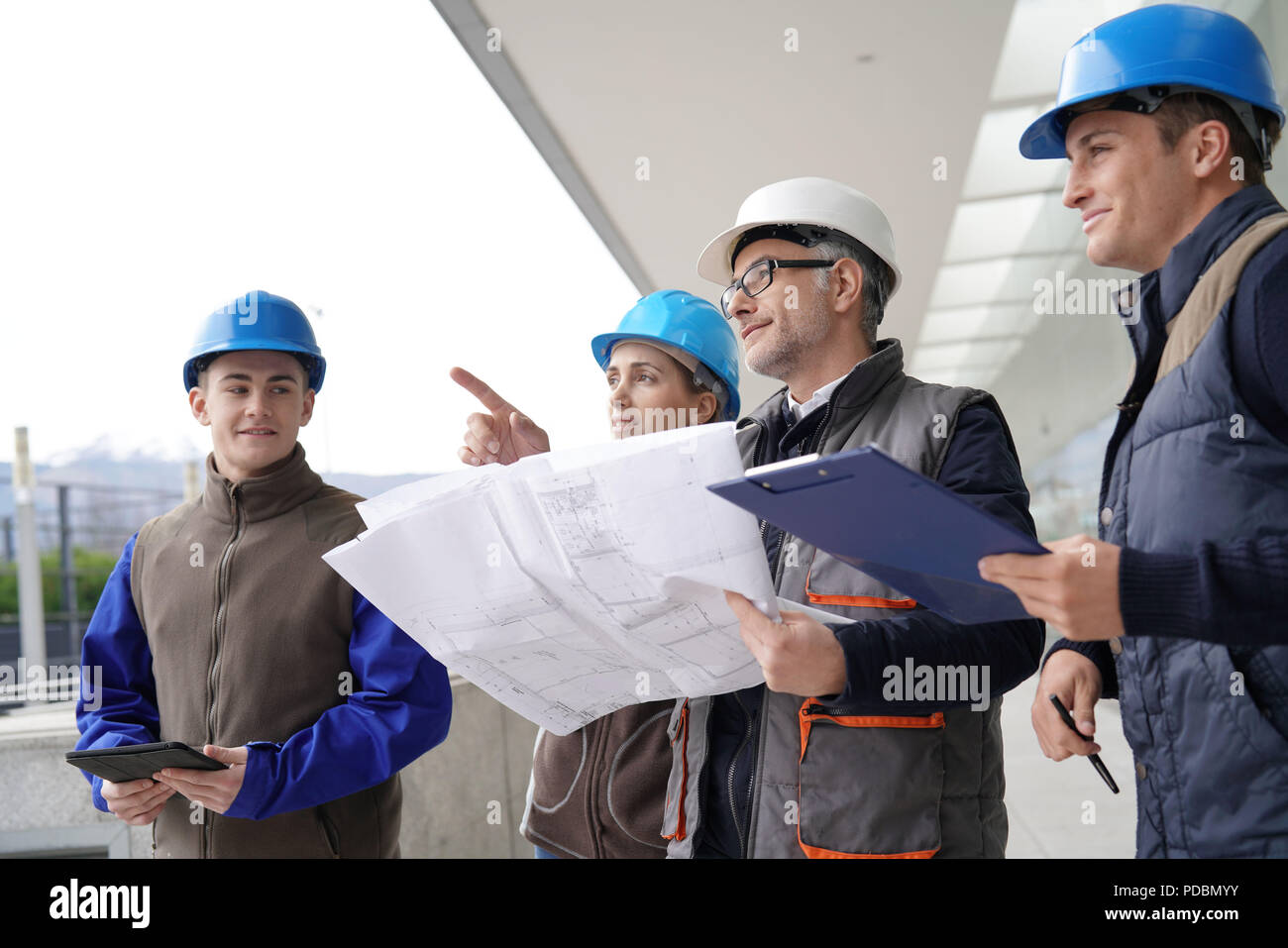 Instructor with young people in engineering training Stock Photo