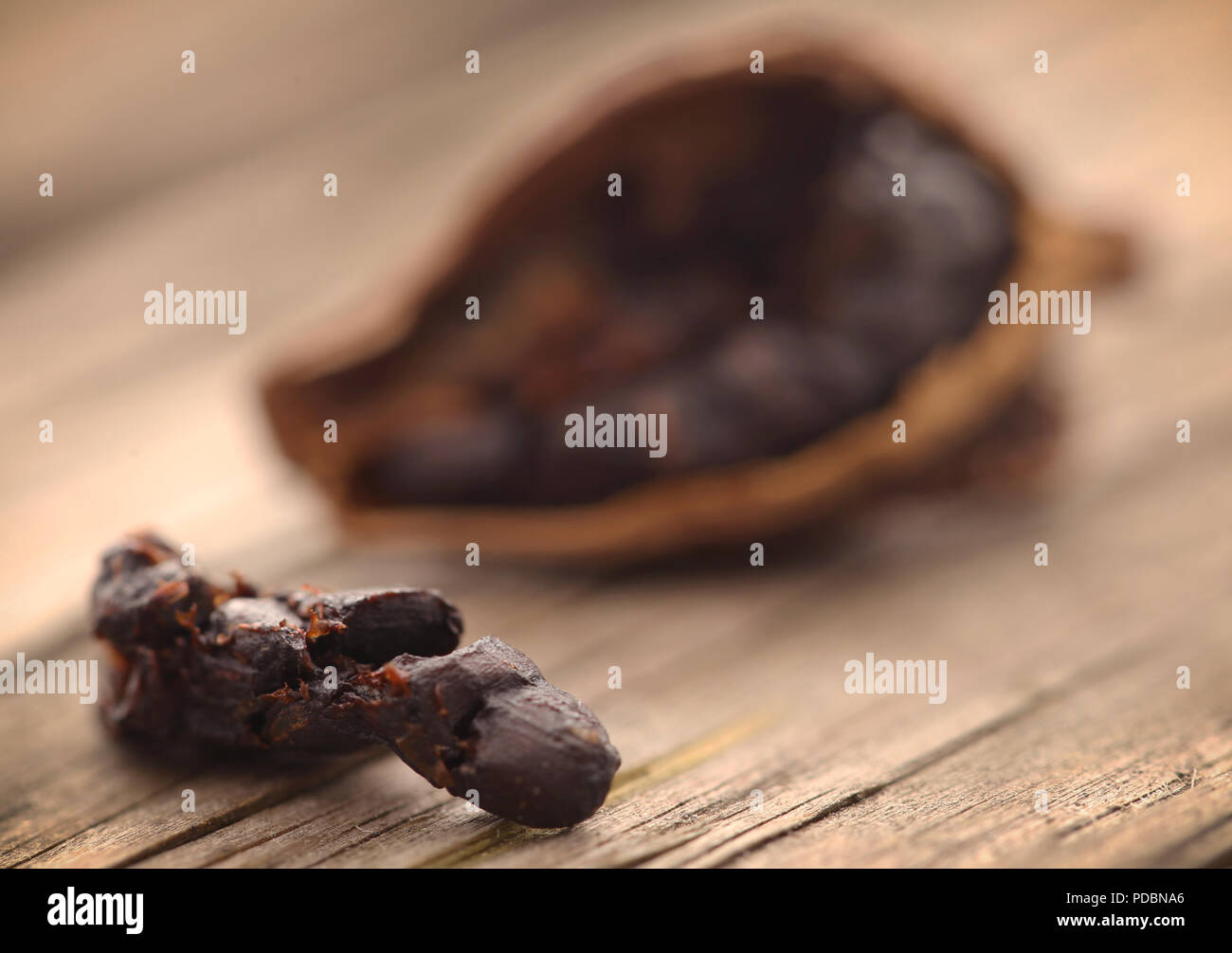 Black cardamom seeds on timber surface Stock Photo Alamy