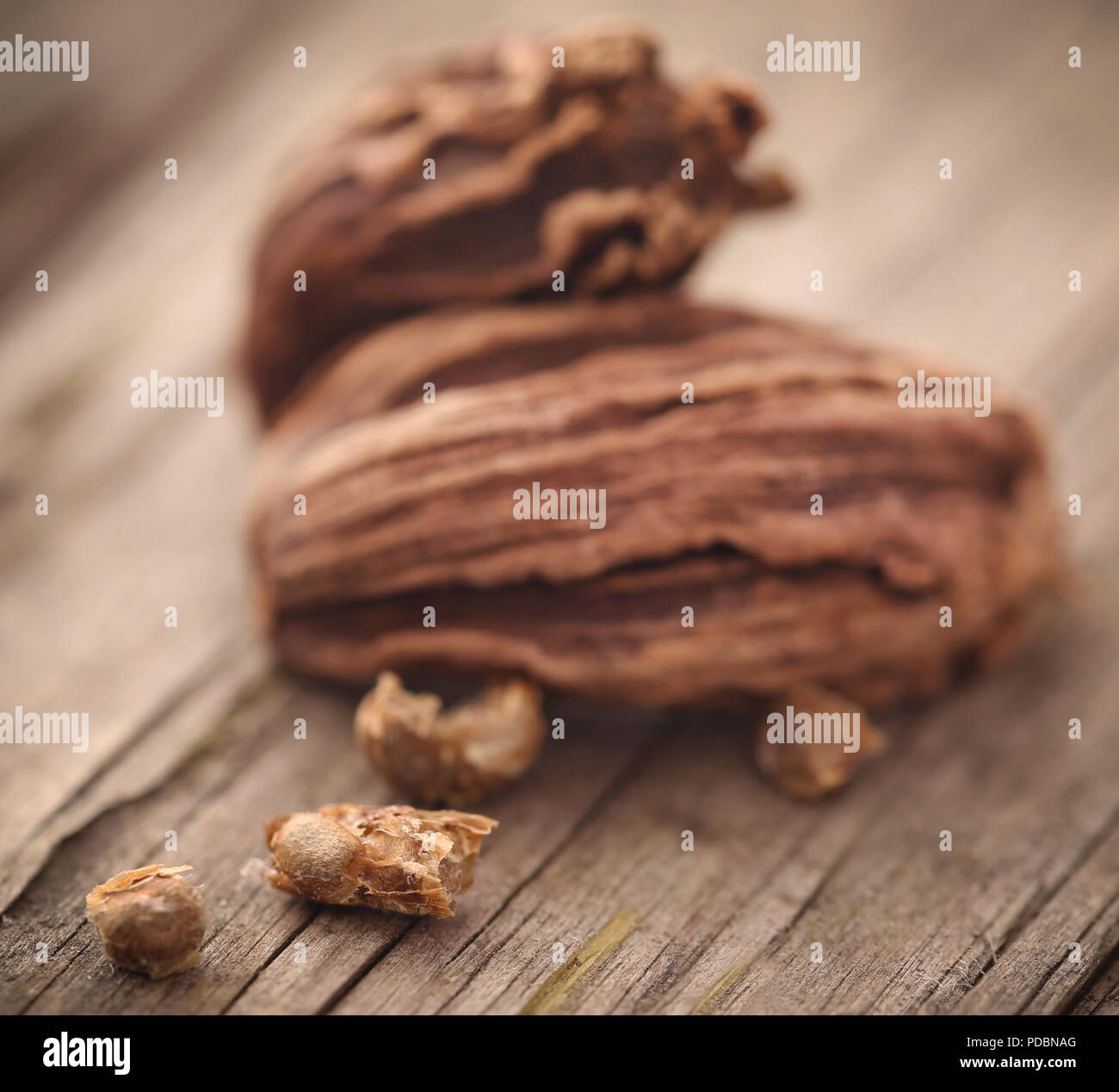 Black cardamom seeds on timber surface Stock Photo Alamy