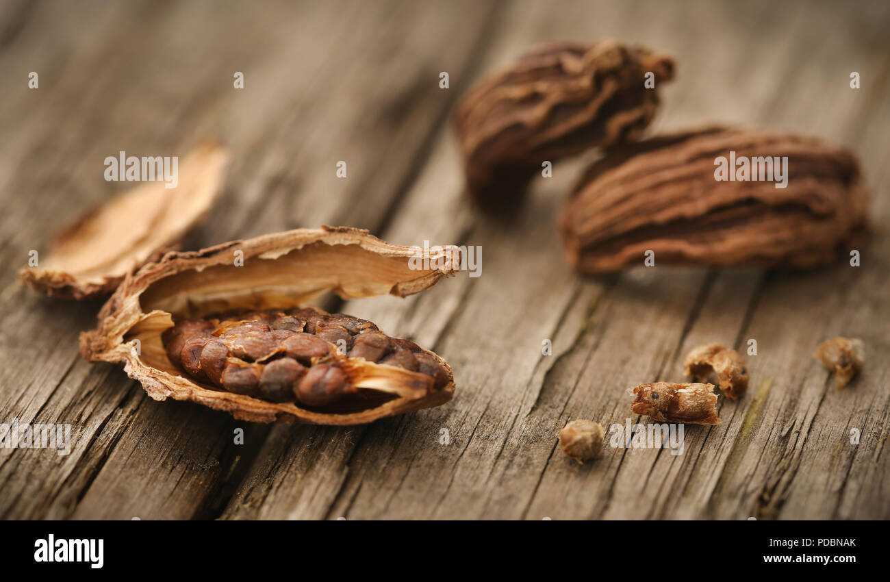 Black cardamom seeds on timber surface Stock Photo Alamy