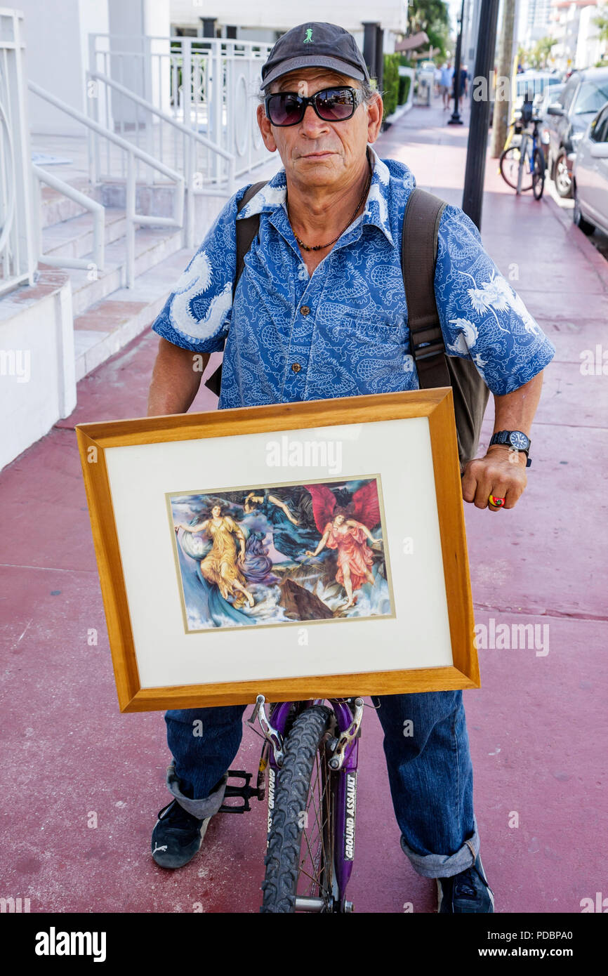 Hispanic Man Riding Bike Hispanic man riding bike beach hi-res stock photography and images - Alamy