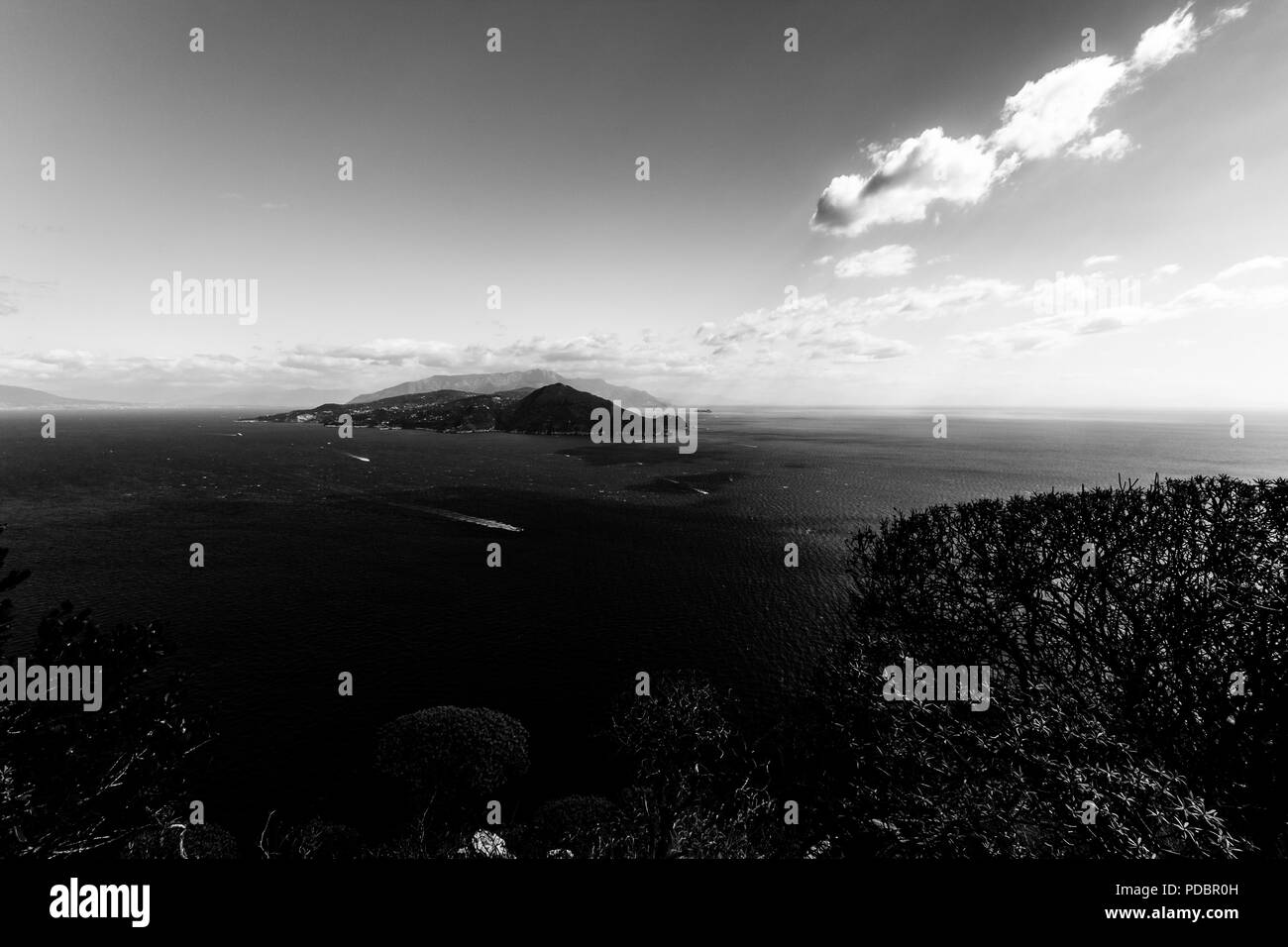 Beautiful aerial view of Capri island, with boat trails on the water